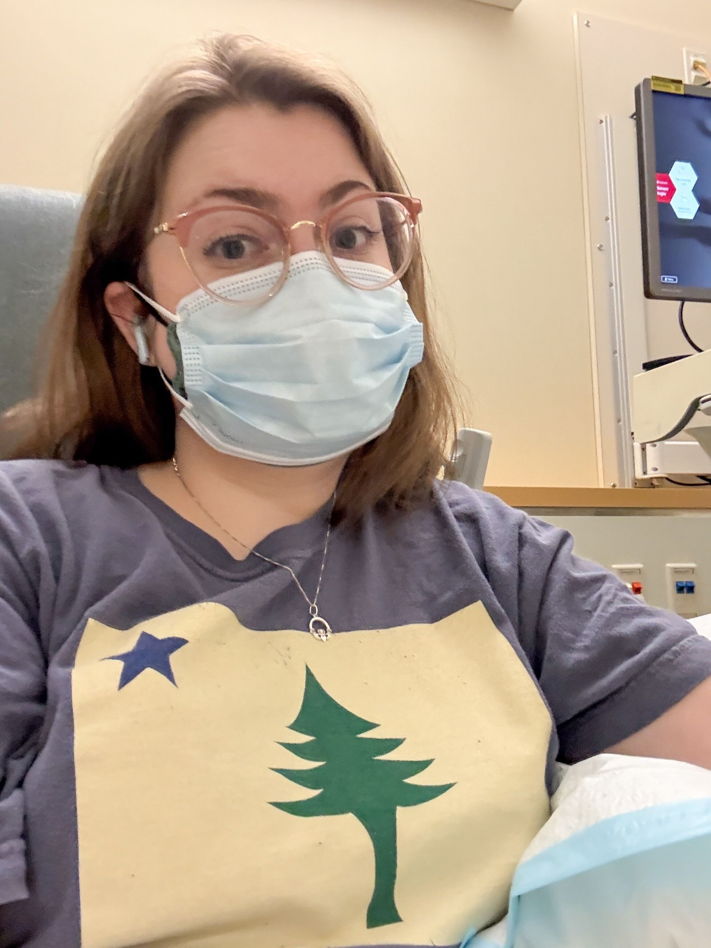 Week 1 of #2026Weekly - a bit delayed because of high pain over the weekend⁣
⁣
1️⃣ First appointment of the year! Got an iron infusion AND my veins cooperated for the IV - a great way to start the year⁣
2️⃣ Iron infusion 2; IV did not cooperate as much but still a success ⁣
⁣
IDs: ⁣
1️⃣ Kate in an infusion chair. She’s a redheaded white woman wearing a shirt with the old Maine flag on it, a blue mask, pink glasses, and blue headphones. ⁣
2️⃣ The Boston skyline at evening ⁣
⁣
#ChronicallyIll #AutoimmuneDisease #Boston
