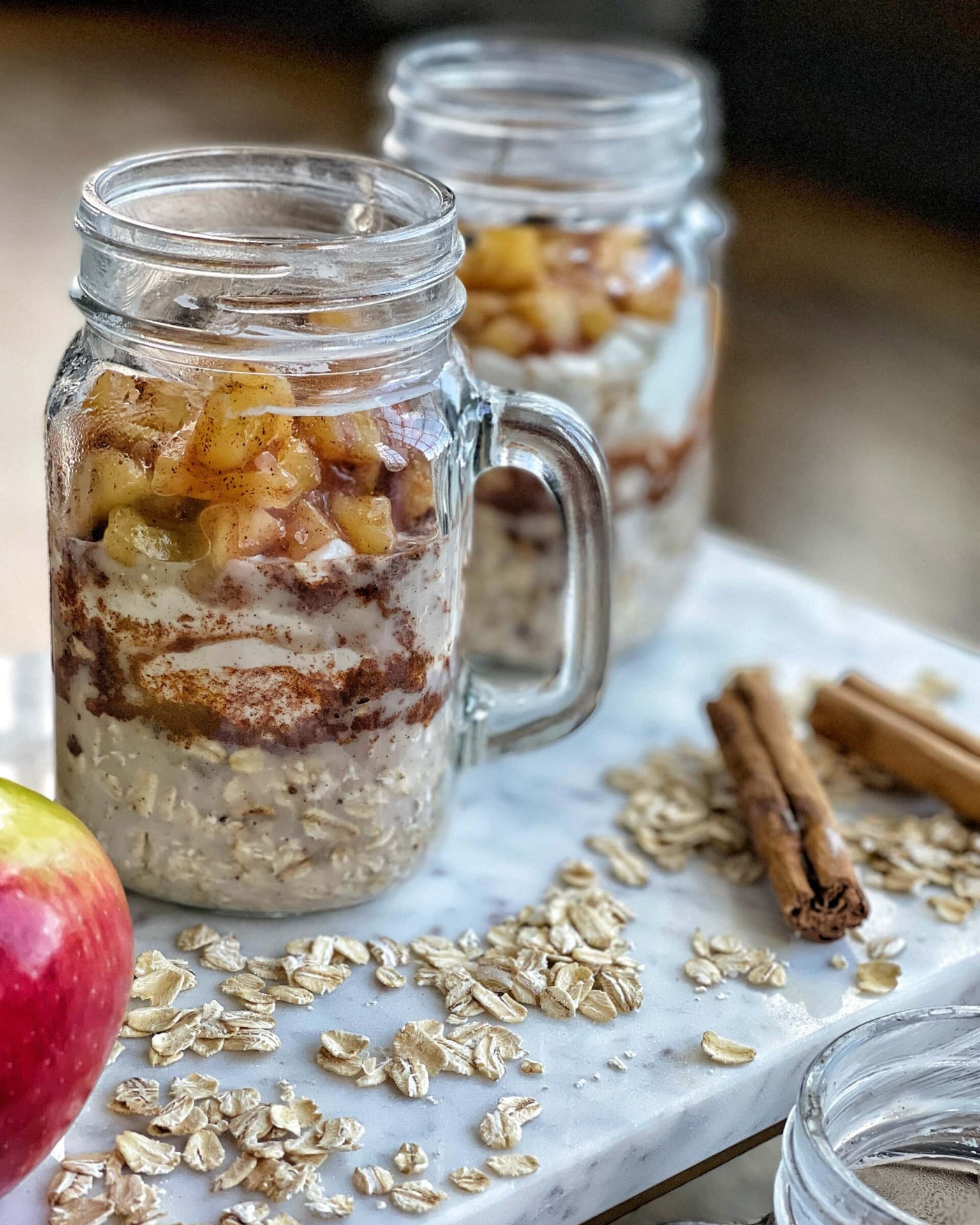 Apple Pie Overnight Oats are made in mason jars for easing transportation and cleanup. Make these ahead of the week for breakfast meal prep all week long! Full recipe on www.sweetsavoryandsteph.com

#LTKHome #LTKSeasonal