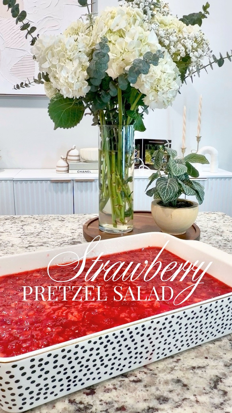 There are two types of people:
People who think strawberry pretzel salad sounds questionable… and people who KNOW this dessert absolutely slaps 😂🍓🥨

This nostalgic strawberry pretzel salad recipe is one of those classic summer desserts that instantly takes me back to church potlucks and family cookouts.

Sweet, salty, creamy, crunchy… honestly she’s iconic for a reason. And yes, I will be doing a little dance every time I eat it. 💃🏼

✨SAVE this for your next BBQ or pool party
✨SHARE with your favorite dessert lover 
✨FOLLOW for more fun in the kitchen
✨Comment SALAD for details on what I used.

RECIPE
6 oz strawberry jello 
2 cups boiling water
12 Tbsn unsalted butter
1/4 cup granulated sugar
2 Cups crushed salted pretzels (4 cups whole)
8 oz cream cheese
1/2 cup granulated sugar 
8 oz cool whip 
1 pound fresh strawberries, sliced or chopped-your choice

1. Preheat oven to 350 degrees.  Combine boiling water and jello until dissolved (do not follow instructions on box) Set aside to cool to room temp
2. Crush pretzels in a sturdy ziplock bag or food processor 
3. In a medium saucepan, melt 12 Tbsp butter, then add 1/4 cup sugar and stir. Mix in crushed pretzels. Transfer to a 13×9 glass casserole dish, pressing the pretzel mix evenly over the bottom of the dish, and bake for 10 minutes at 350°F, then cool to room temperature.
4. Using a hand mixer, combine cream cheese, 1/2 c sugar.  Then fold in cool whip.  Spread over cooled pretzel layer, making sure to seal edges to prevent layers combining later.  Set in fridge for 30 minutes. 
5. Combine room temp jello and strawberries and pour over cream layer.  Cover and place in fridge to set for 2-4 hours. 
Enjoy!

#strawberrypretzelsalad #nostalgicrecipes #summerdesserts #vintagerecipes easydesserts potluckrecipes dessertrecipes strawberrydessert southerndesserts midwestrecipes churchcookbookrecipes summerrecipe pretzeldessert millennialmom momcontentcreator easyrecipeideas cookoutfood familyrecipes foodreels comfortfoodrecipes sweetandsalty recipecreator homemadedessert viralrecipes oldfashionedrecipes

#LTKootd #LTKfoodie #LTKHome