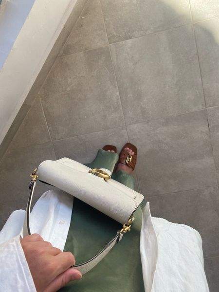 Coach shoulder bag, olive satin skirt, oversized white linen shirt, brown sandals 

#LTKstyletip #LTKeurope #LTKsummer