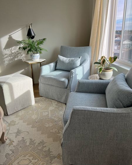 My new sitting area in my bedroom! Finally have a spot for hubby and I to have private conversations without kids or dog interruptions. These blue slope arm upholstered slipcover accent swivel chairs are amazing. Comfortable and pretty! Chairs pair perfectly with my Safavieh wool rug and linen look striped ottoman. 

These chairs would great in the living room too. My ottoman is on sale!

Coastal, neutral, office space

#LTKsalealert #LTKhome