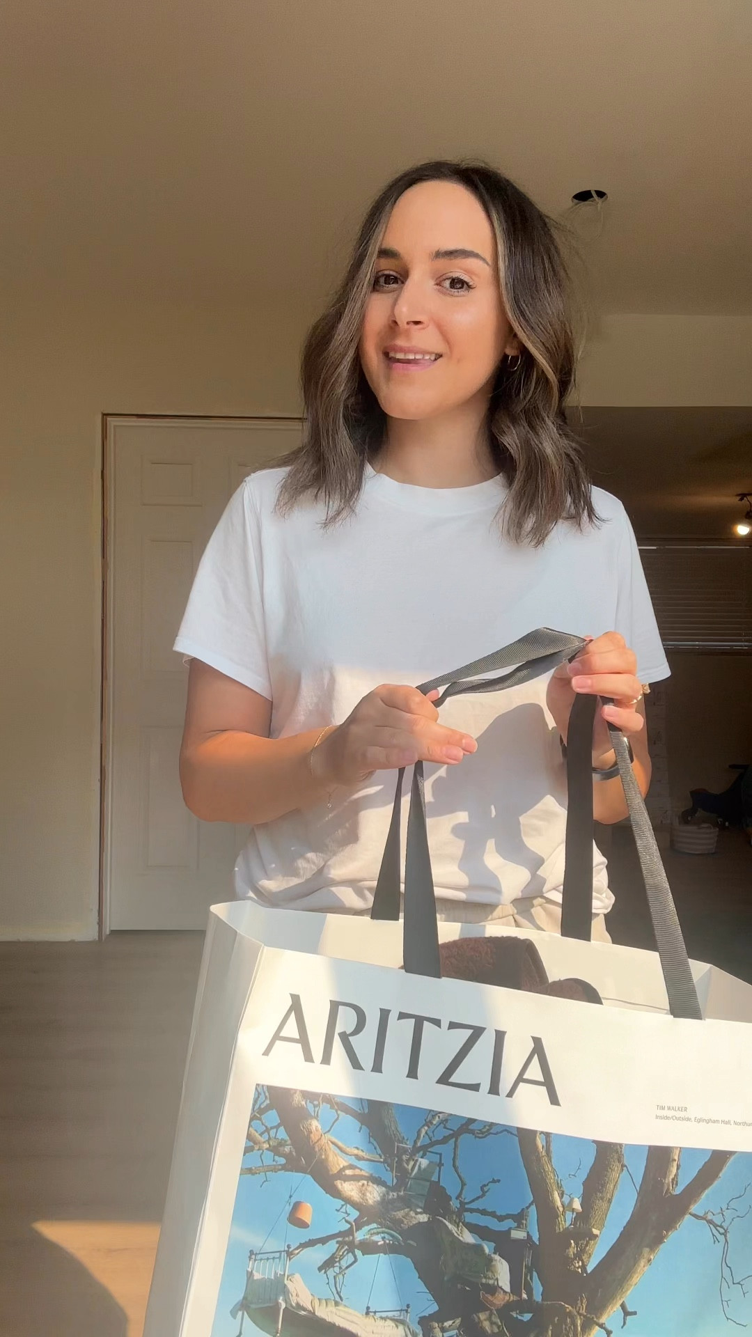 Aritzia Fall Haul | Grabbed some basic tees, a cozy Aritzia hoodie, and a fleecy brown vest for fall. I got a small in all tops except for the cream t-shirt (L) and the vest is XS. 

#LTKcanada #LTKstyletip #LTKautumn