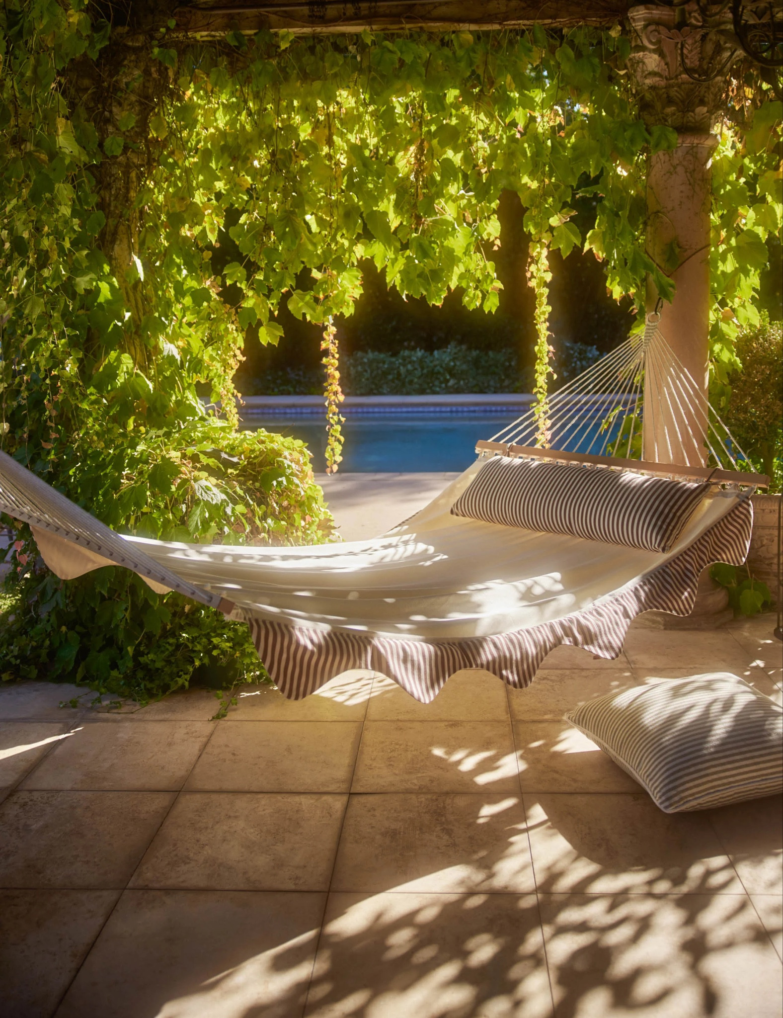 Looking forward to chilling out in your backyard in the coming warmer days? LA designers Sarah Sherman Samuel just dropped her first outdoor collection for Lulu and Georgia. We love Sarah’s relaxed yet refined designs. Among of this new outdoor collection, the Levata hammock is such a chic piece to make you lounge in your backyard in style thanks to its resort-feel stripped trims and matching pillows. #outdoorliving #backyard

#LTKSeasonal #LTKhome #LTKfamily
