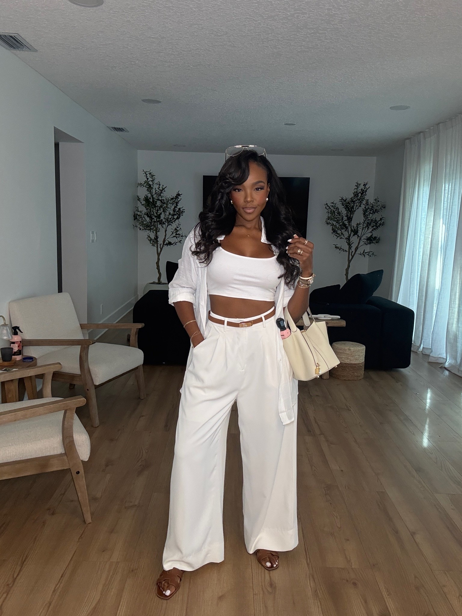 Hi Babes! 🤍☀️

This all-white vacation look is giving effortless luxury. The flowy pants, classic white crop top, and lightweight button-down are the perfect combo for staying cool while looking put together.

✨ Fit Details:
• True to size
• Lightweight linen-blend feel
• Relaxed wide-leg pants
• Layered with an oversized button-down
• Perfect neutral vacation outfit

🤍 Where to Wear:
• Resort mornings
• Beachside brunch
• Sightseeing
• Airport travel
• Poolside lunch

✨ Style Tip:
Add gold jewelry, a woven tote, and comfy slides or sandals for an elevated vacation-ready look.

Everything is linked below!

xx, Kira | IG: KirasFashionFinds

Measurements:
Kira: 5'4" | Size Small | 140 lbs