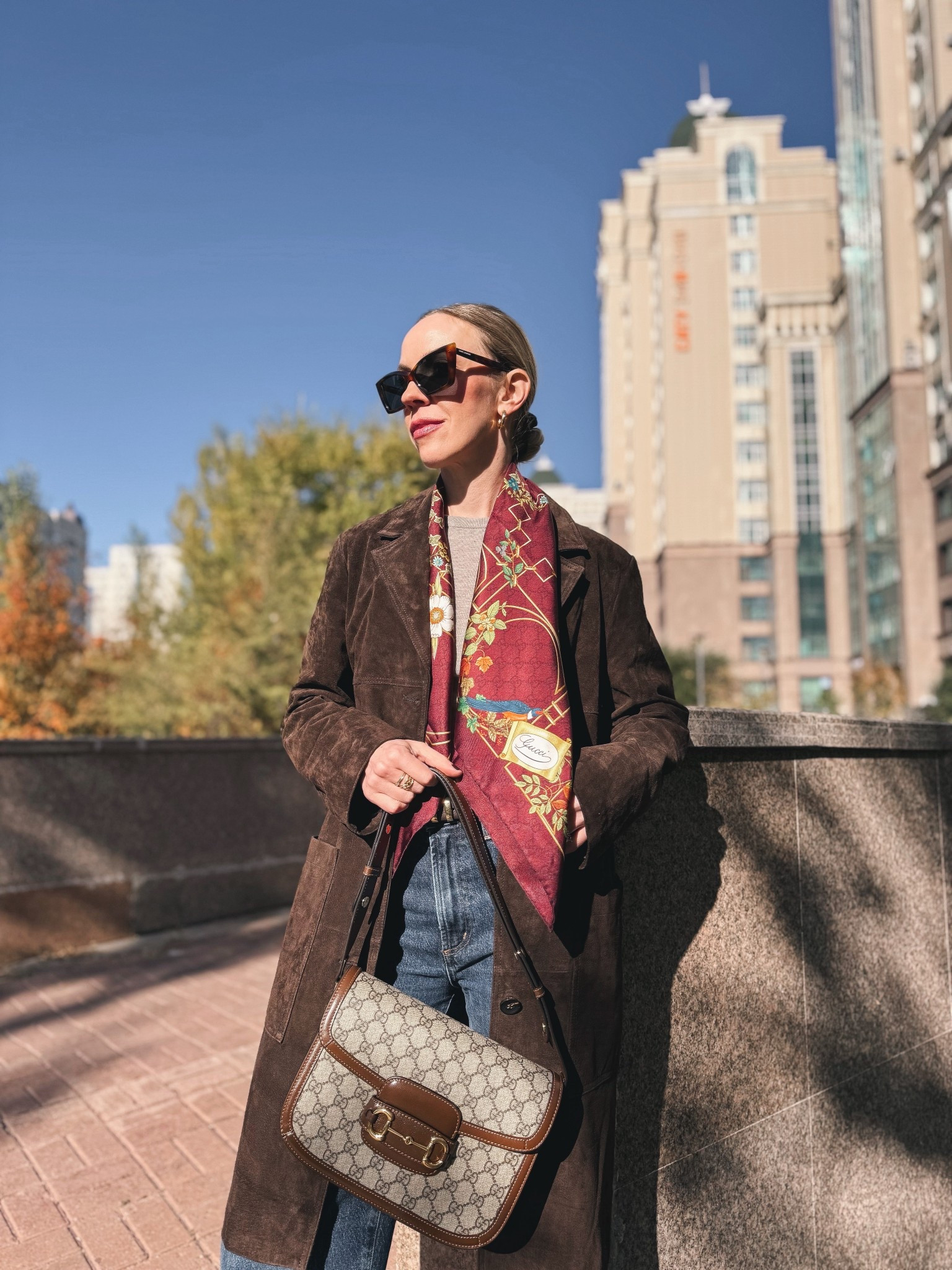 Spring outfit, @Zara chocolate brown suede coat, Gucci burgundy silk scarf, @Shopbop dark wash jeans, Gucci bag

#LTKSeasonal #LTKOver40 #LTKSaleAlert