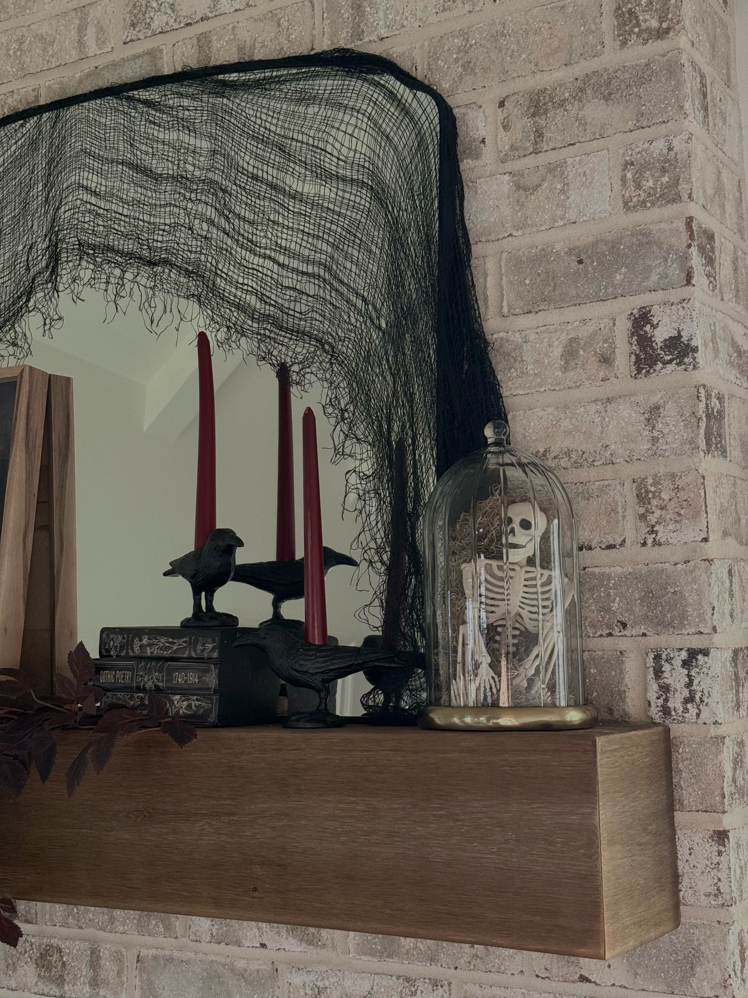 Spooky Halloween mantle styling 👻🎃 

*exact crow candlestick holders are from Homegoods

#LTKHome #LTKSeasonal #LTKSaleAlert