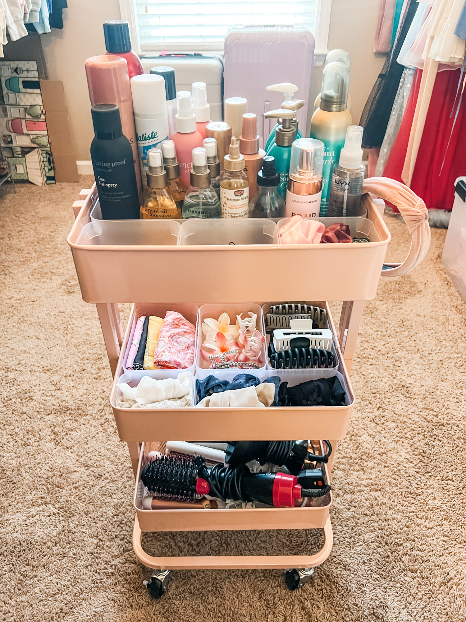Filling a three-tiered cart with everything you need for your hair/face/body turns it into a mobile beauty shop which is perfect if space is at a premium! Slide it wherever you plan to get ready for your day - and then wheel it back into the spot where it lives. Win/win! 

 