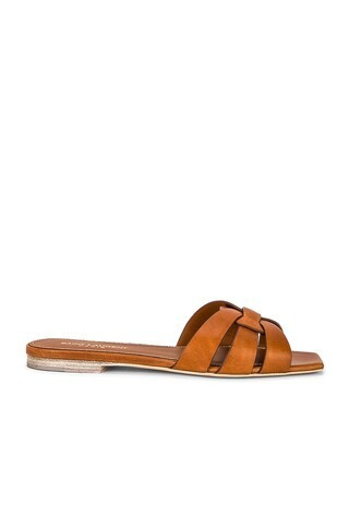 Saint Laurent Tribute Flat Sandal in Amber - Brown. Size 35.5 (also in 35, 37, 39, 40.5). | FWRD 
