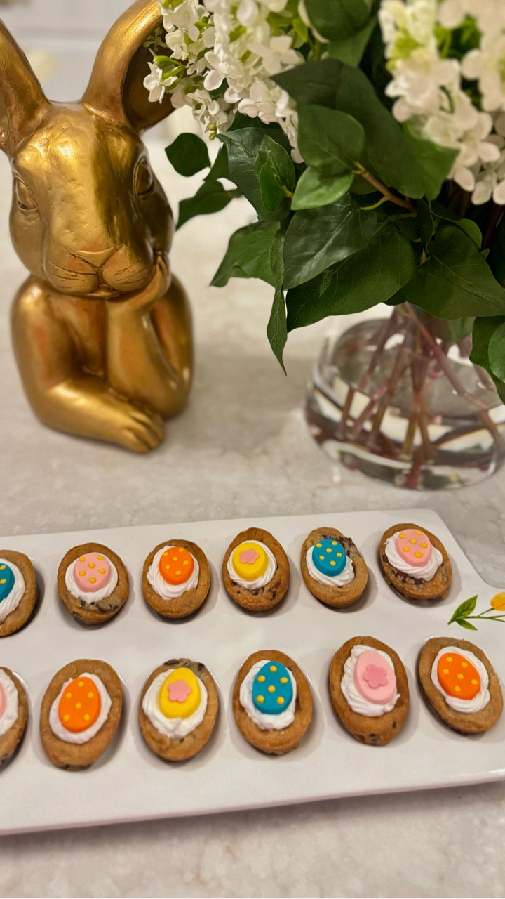 Easter entertaining just got sweeter 🐣✨

These mini chocolate chip cookie bites topped with whipped frosting and the cutest pastel egg candies are the perfect little spring treat! Easy to make, adorable to serve, and guaranteed to disappear fast 💛

Styled with my favorite gold bunny and fresh florals for that classic JustJennsDesign touch 🌿🐰 Whether you’re hosting brunch, bringing dessert to a gathering, or creating a festive dessert board — these are the sweetest addition to your Easter table.

Tap to shop my Easter serving pieces + decor favorites 🤍✨

#JustJennsDesign #EasterEntertaining #EasterDesserts #SpringDecor #HolidayHosting #EasterTable #BunnyDecor #PastelVibes #HomeStyling #SeasonalDecor #LTKhome #LTKspring #LTKseasonal #EntertainingAtHome #SweetTreats

