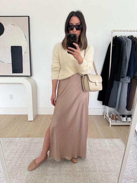 Holiday outfit ideas. This skirt is amazing!!! Size down. Sweater is old Velvet. There’s only a few sizes left. Linked similar too. 

Holiday outfits, Christmas outfits, thanksgiving outfits, slip skirt 

Velvet sweater small
Madewell skirt 0. Need the 00
Mansur Gavriel flats 35
Sezane bag
Celine sunglasses. 

#LTKCyberWeek #LTKHoliday #LTKSeasonal