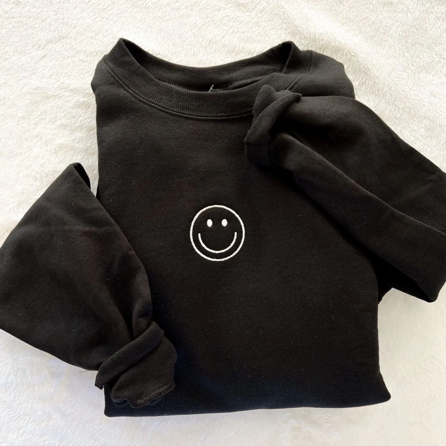 smiley face sweatshirt | black | Reef rain aria