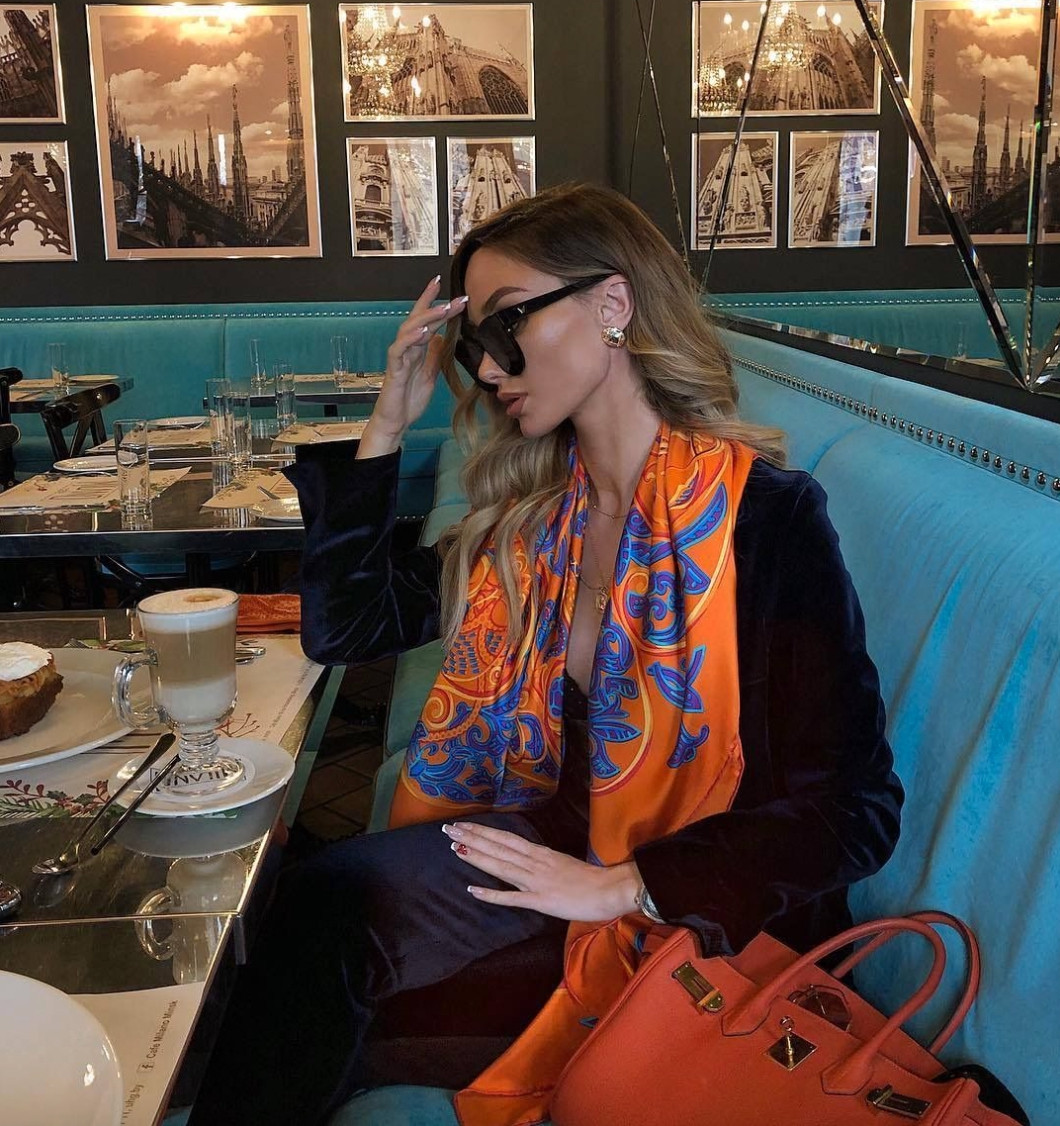 This elegant outfit pairs a sleek black ensemble with a vibrant silk scarf for a sophisticated café style moment.
The bold scarf and structured handbag add color and personality, turning a simple outfit into a polished, elevated look perfect for stylish lunches or city outings.  

 #LTKdayinmylife #LTKootd