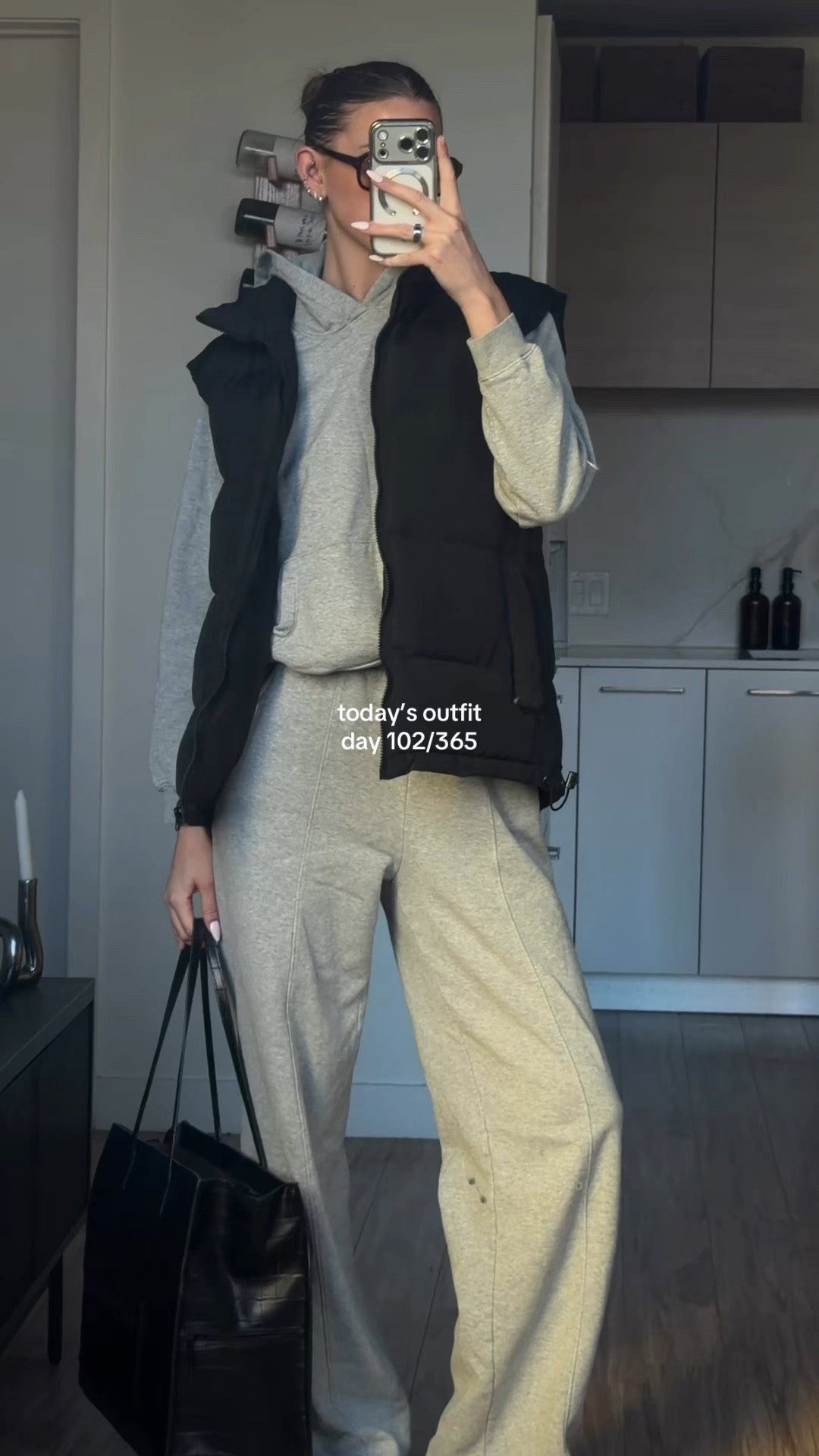 what I’m wearing today 👟🩶 casual spring outfit inspo 

@Gap grey sweat set (hoodie & wide leg sweatpants)
@Missguided black oversized puffer vest
@ASICS chunky white everyday sneakers (gel-1130)
@BÉIS black croc large tote bag
@vehla brown tortoise chunky sunglasses

#ootd #everydaylook #springoutfitideas #dailystyle #styleinspo 

#LTKTall #LTKgrwm #LTKootd