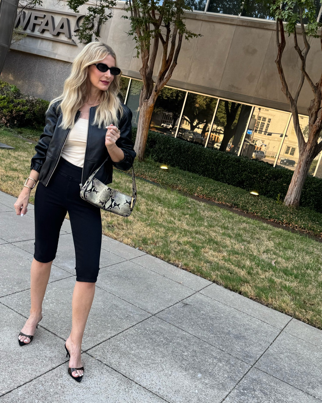 The chicest fall leather jacket outfit featuring two of the season’s biggest trends: a cropped leather jacket and sleek capri pants. The pointed-toe heels and snake-print bag give this all-black look an elevated finish. I’m wearing an XS in the jacket and capri pants. #LTKOver40 #LTKSeasonal #LTKStyleTip 

 #LTKootd #LTKSeasonal #LTKOver40