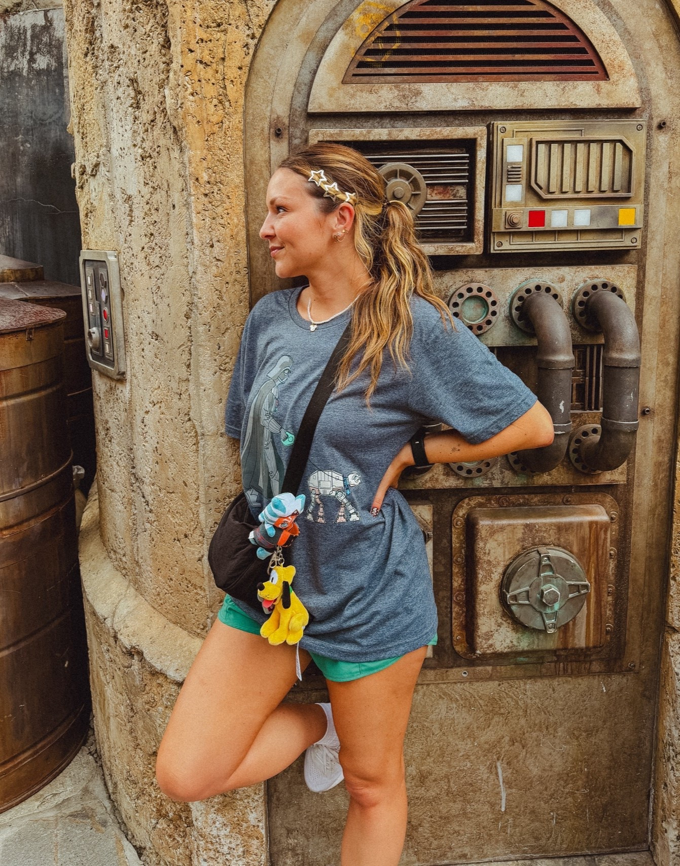 Star Wars Disney OOTD ✨ Easy + comfy Galaxy’s Edge park outfit featuring an oversized Star Wars tee, running shorts, ASICS sneakers, star hair clips & my park bag! #DisneyOOTD #DisneyStyle #StarWarsStyle #GalaxysEdge #DisneyWorld #DisneyOutfit