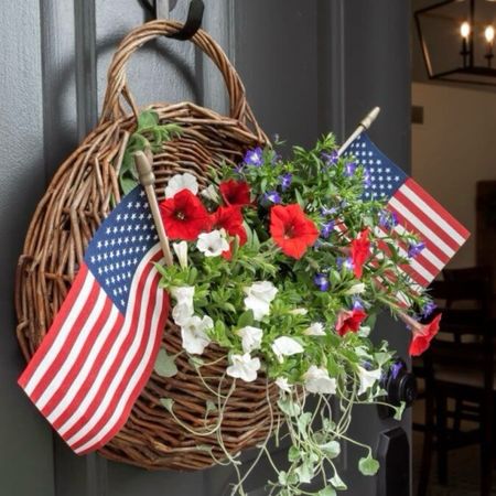 Looking for something different than a wreath for to hang on your front door? Decorate for summer with a hanging door basket filled with red, white, and blue summer annuals and American flags. 

#LTKSeasonal #LTKFindsUnder50 #LTKHome