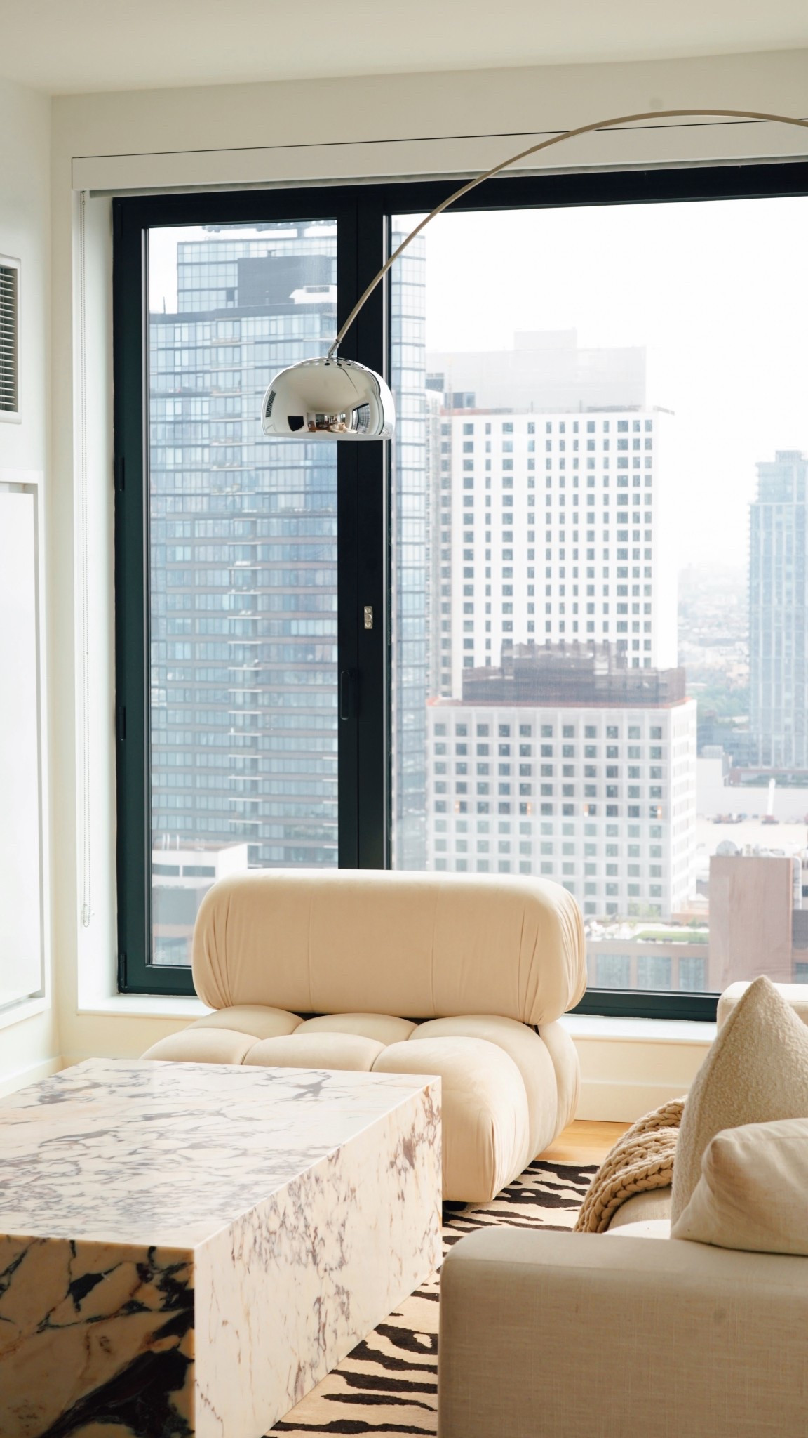 Both the Mario Bellini Accent Chair and 8ft Arco Lamp are two of my dream pieces and truly elevate my living room. I’m big on texture and both of these pieces add a bunch. From early morning tea, soaking up the city views to evenings listening to my favorite vinyls? I’m never leaving. 

Oh! The coffee table is also from Manhattan Home Design and they’re currently having a Fall Refresh sale for 15% off. 

Thank you @Manhattan.home.design for elevating my space. Comment ‘cloud’ for links to these pieces on my @shop.LTK #liketkit #Ad 

#LTKHome