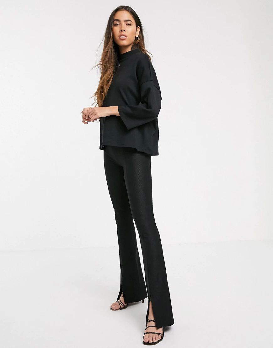 Stradivarius ribbed jersey flare pants with slit in black | ASOS (Global)