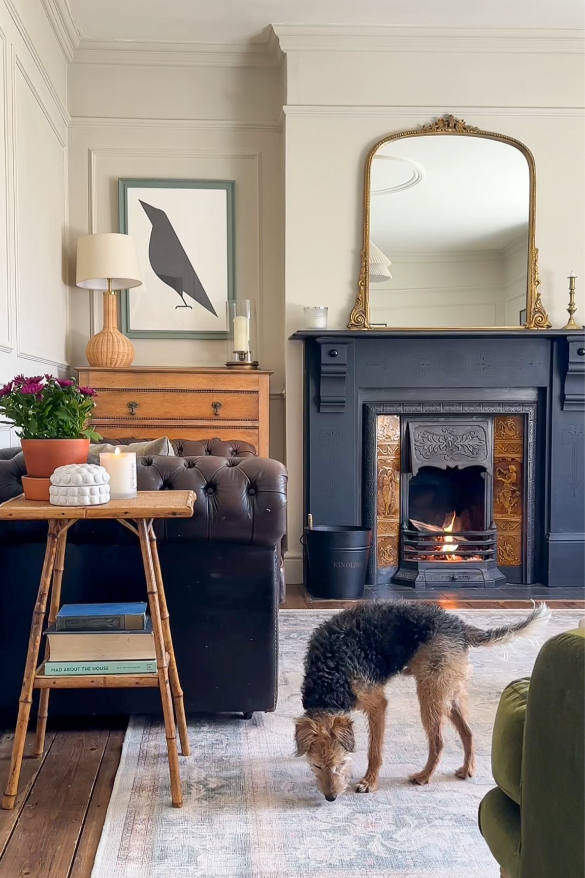 Modern vintage inspired living room with reclaimed slate fireplace, large statement over mantle mirror, vintage bamboo side table and graphic art. 

#LTKeurope #LTKuk #LTKhome