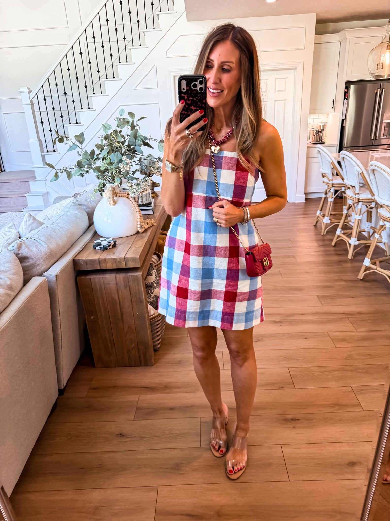Red, white, and cute ❤️This little gingham dress is giving all the summer plans energy. It’s lightweight, easy, and one of those throw on and instantly feel put together pieces. Paired it with a pop of red and clear heels to keep it fresh and simple

summer dress, gingham outfit, 4th of july outfit, casual summer style, easy outfit ideas, themominstyle 

#LTKSeasonal #LTKOver40 #LTKootd