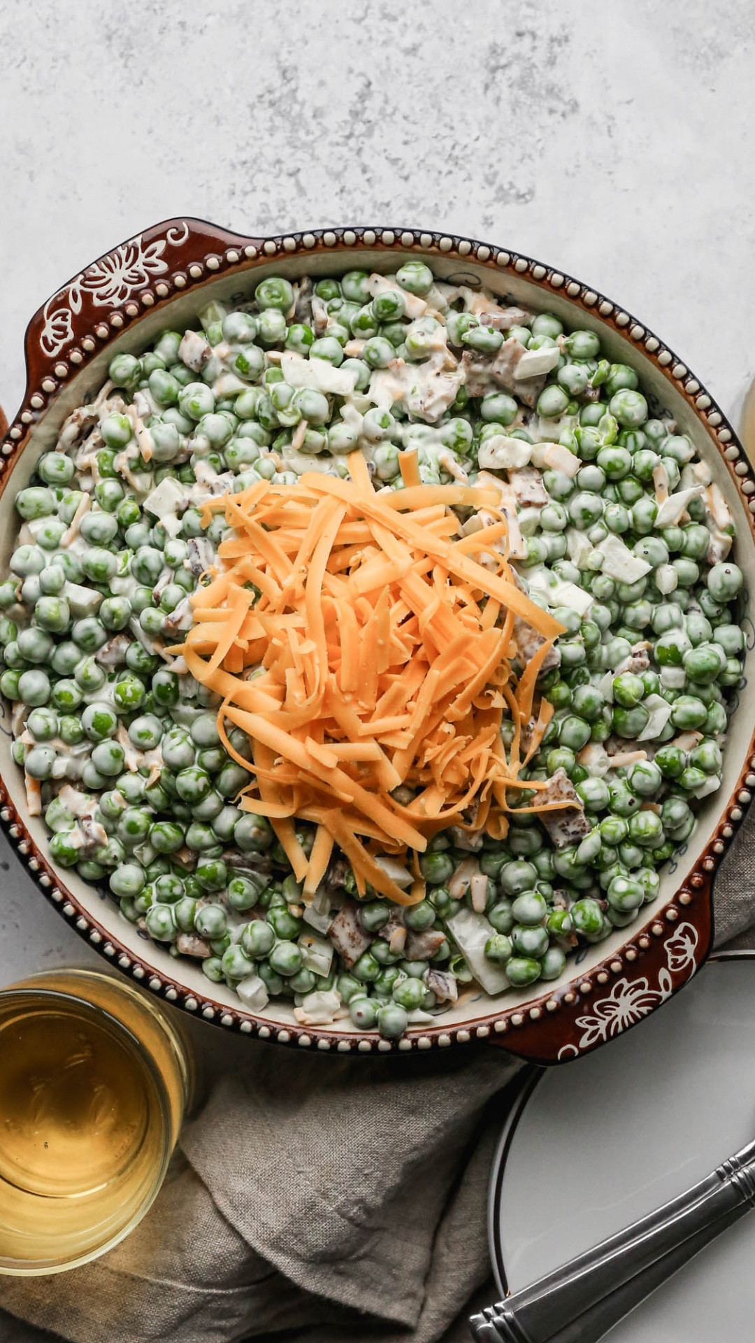 This recipe for easy pea salad is a holiday favorite. I make it the day before a gathering. The recipe is on my website Small Farm Big Life  

This 3/4 sleeve tee from Amazon is soft and one of my favorite tops. I need to get it in more colors. 

This charm necklace is from American Eagle and would make a great gift or stocking stuffer. 

This mixing bowl is old but I will link some that are similar. I love heavy ceramic bowls for making salads in  

#LTKHome #LTKfoodie