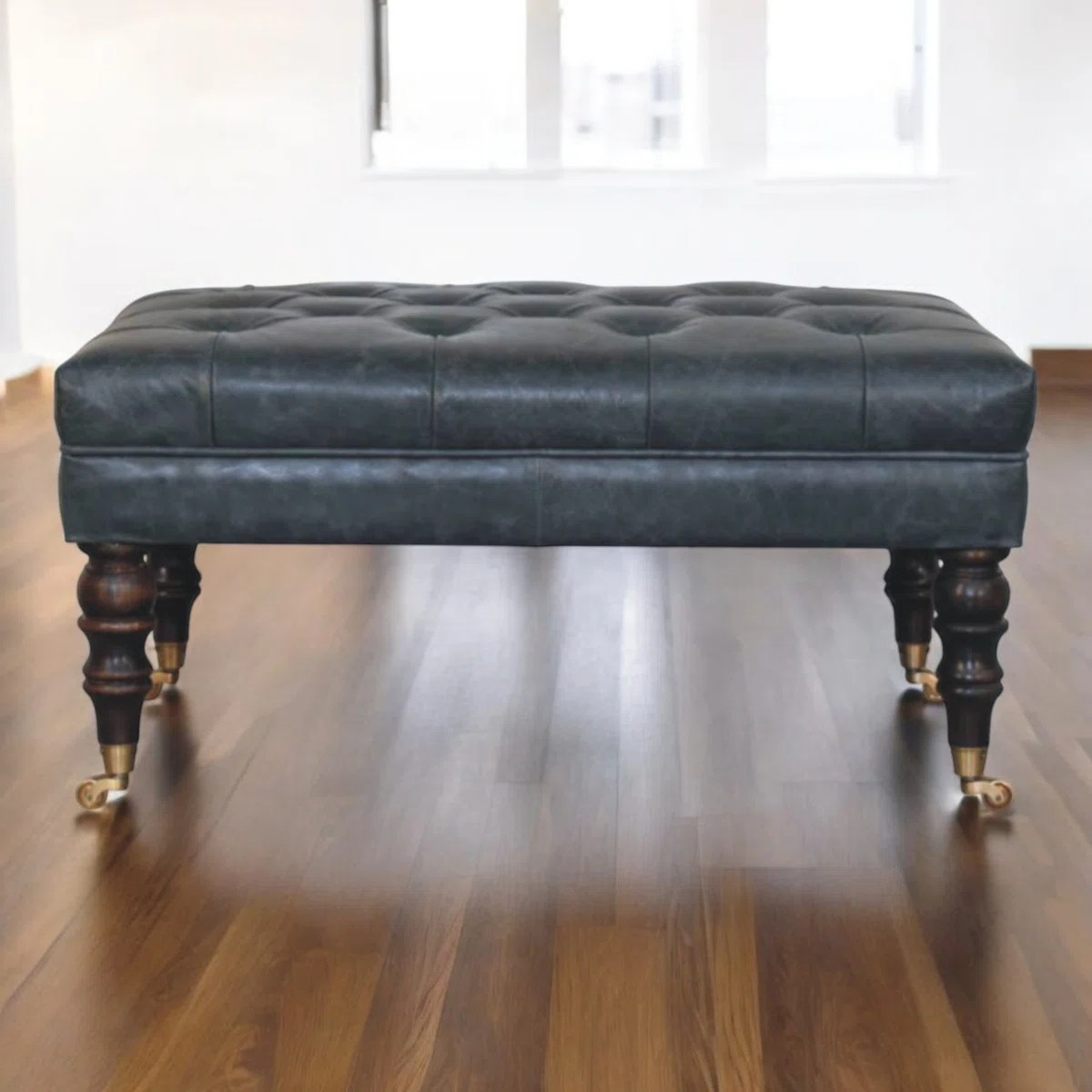 Buffalo Teal Leather Ottoman With Castor Legs | Wayfair North America