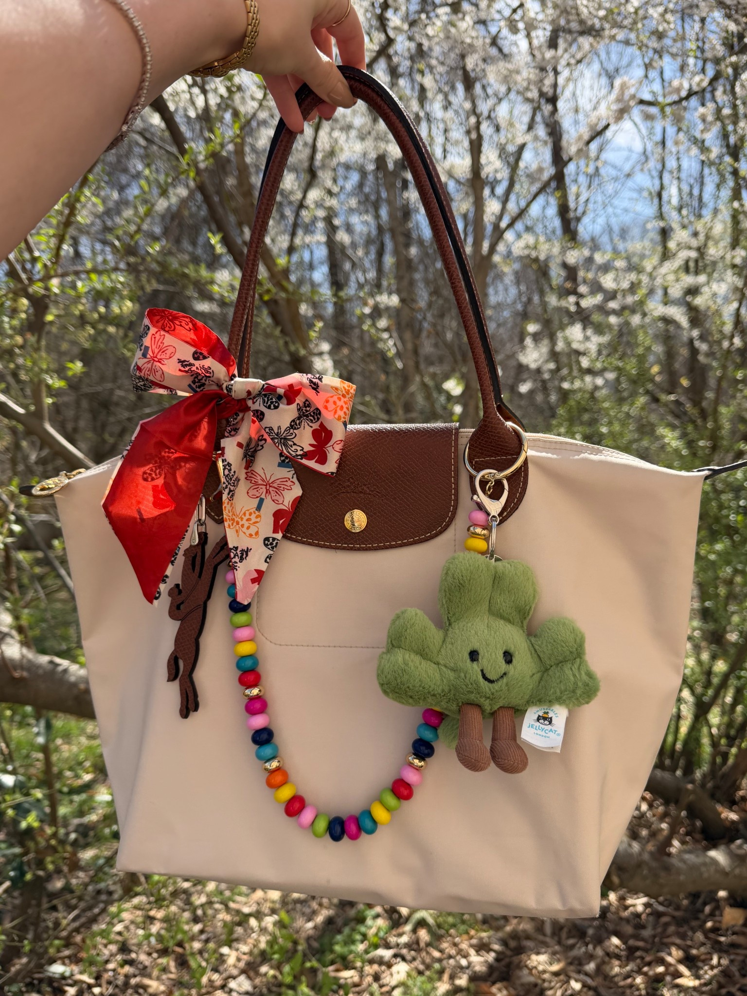 Feeling springy 😍 
Longchamp medium Le Pliage in the color paper
Longchamp keychain bag charm
Jelly cat shamrock bag charm
Baublebar bead bag chain 


#LTKSpringSale #LTKootd