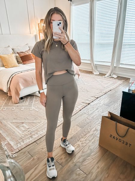 workout outfit - love these leggings! wearing an xs in bottoms, small in top and bra. color is pyrite. front tucked my top to show how high rise the leggings are  

#LTKfindsunder100 #LTKsalealert #LTKfitness