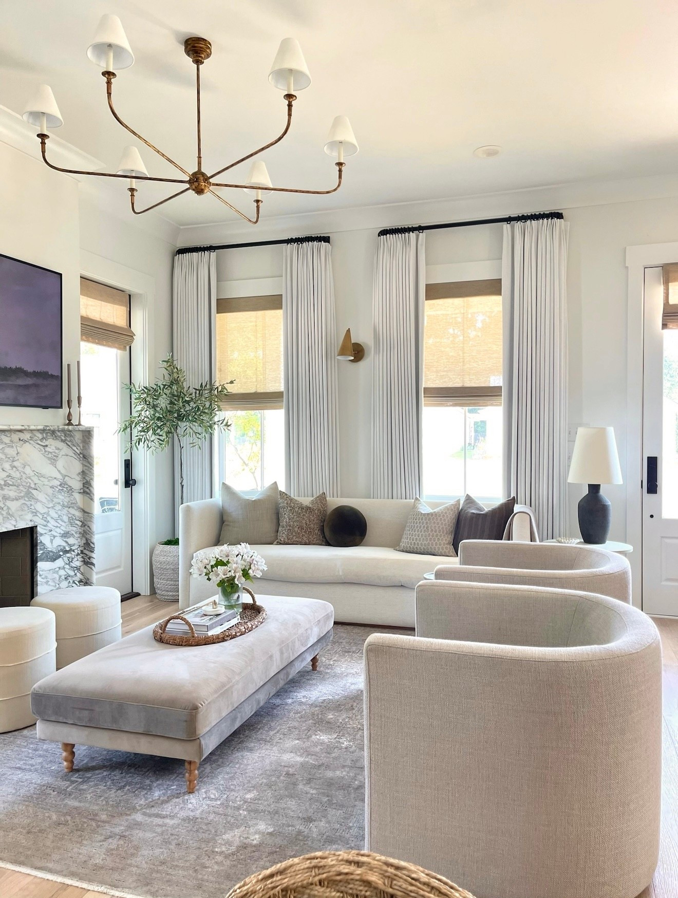 Fall decor, home decor, living room decor, living room rug, coffee table, two pages curtains, swivel chairs, coffee table decor, brass chandelier, Target ottomans, sofa pillows 

#LTKHome #LTKSeasonal #LTKSaleAlert