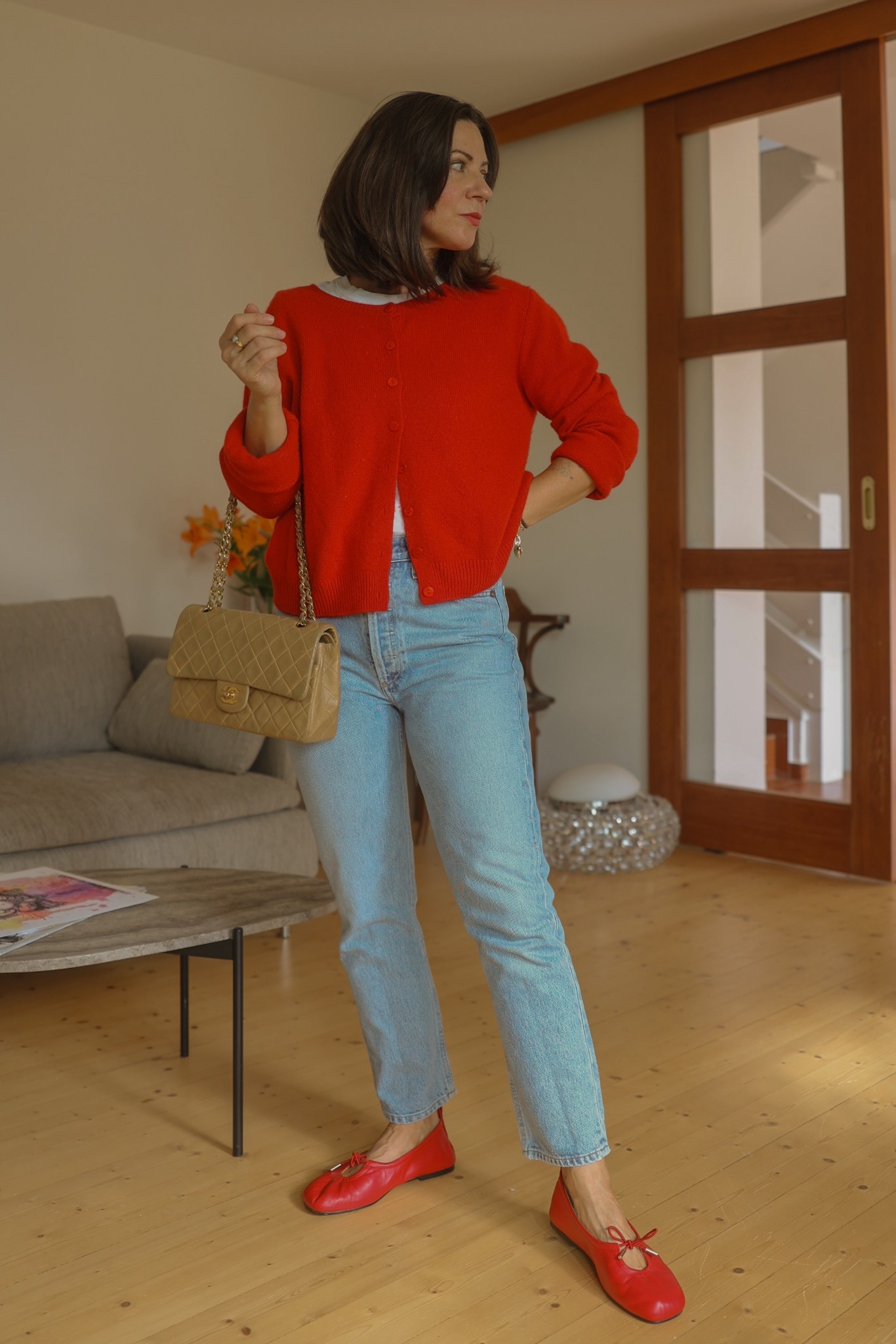 Straight jeans in a vintage blue denim, red cashmere cardigan (95% recycled cashmere) white tee and red ballet flats. 



Jeans: Agolde Riley crop (wearing 27)
Ballet flats: Alohas
White tee: Organic basics
Cardigan: Reformation 
Bag: Chanel Vintage



#LTKeurope #LTKpetite #LTKautumn