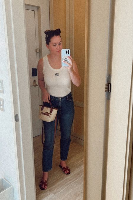 Ashley Butterfield of SideSmile Style wears a Loewe tank and mom jeans with a