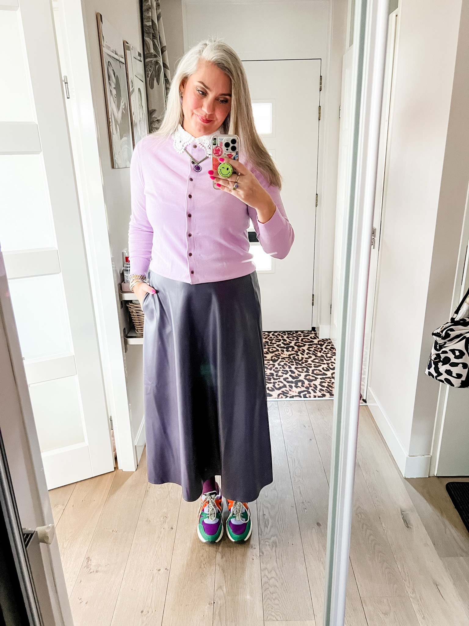 Ootd - Saturday. Work out done and going out for lunch. Wearing a wool lavender cardigan over a heattech baselayer, a lace collar, smiley necklace (Shoeby). Purple leather midi skirt (local boutique), purple tights (Snag) and colorful chunky sneakers (Scapino). 

#LTKeurope #LTKnederlands #LTKFashionMonth