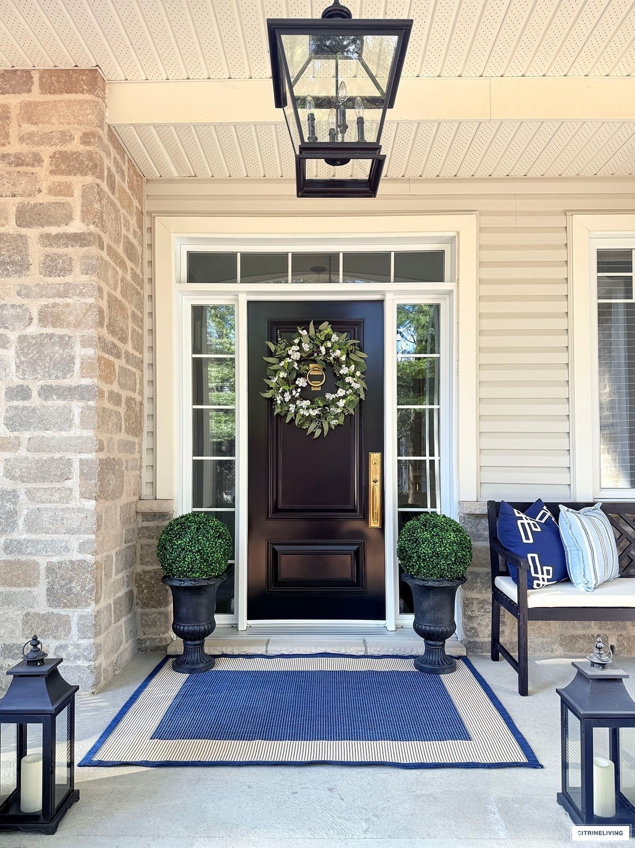 Simple, chic, elegant porch decor! Classic urns, elegant topiaries, a coastal rug, a timeless bench and lush wreath create a warm welcome!

#LTKSeasonal #LTKHome
