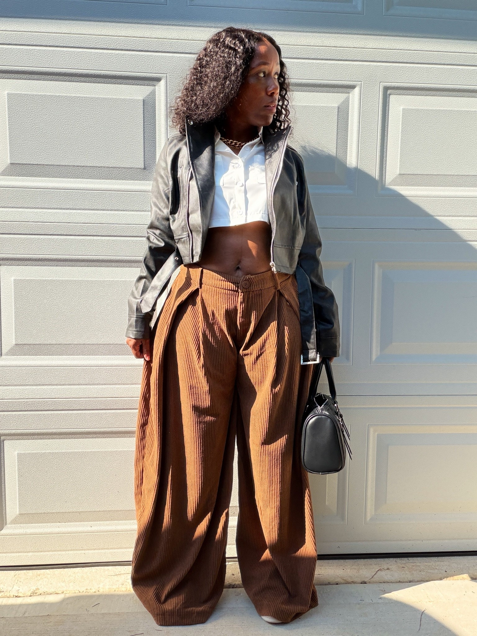 Wondering how to style a cropped leather jacket? I paired mine with oversized brown pants, a white cropped shirt, sneakers and a black handbag for a casual everyday outfit..

#LTKootd #LTKOver40 #LTKPetite