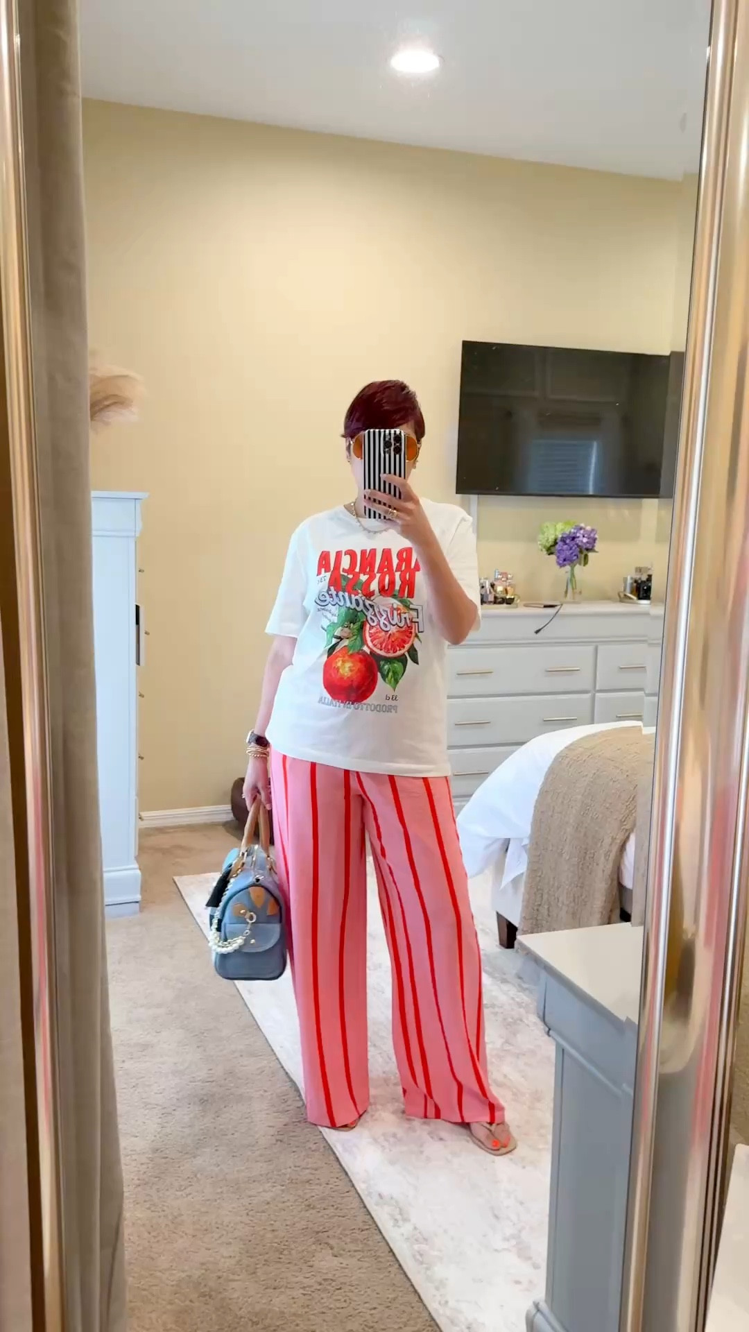 Spring outfit 
Graphic tee and striped pants 

#LTKootd #LTKMidsize #LTKgrwm