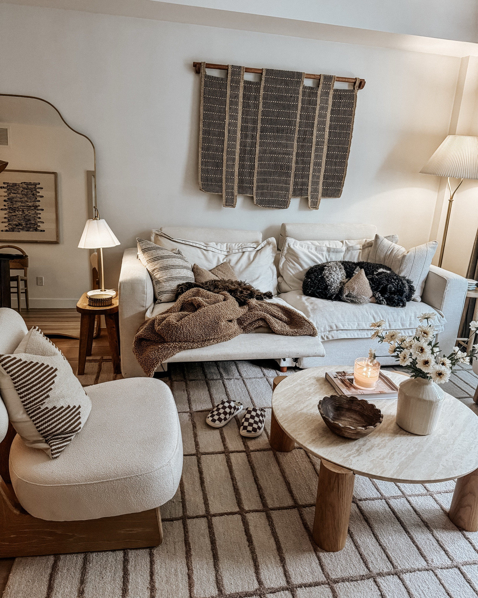Cozy weekend living room vibes. Just gonna have to scooch right in between the pups 😆 

Neutral living room, living room decor 

#LTKStyleTip #LTKHome