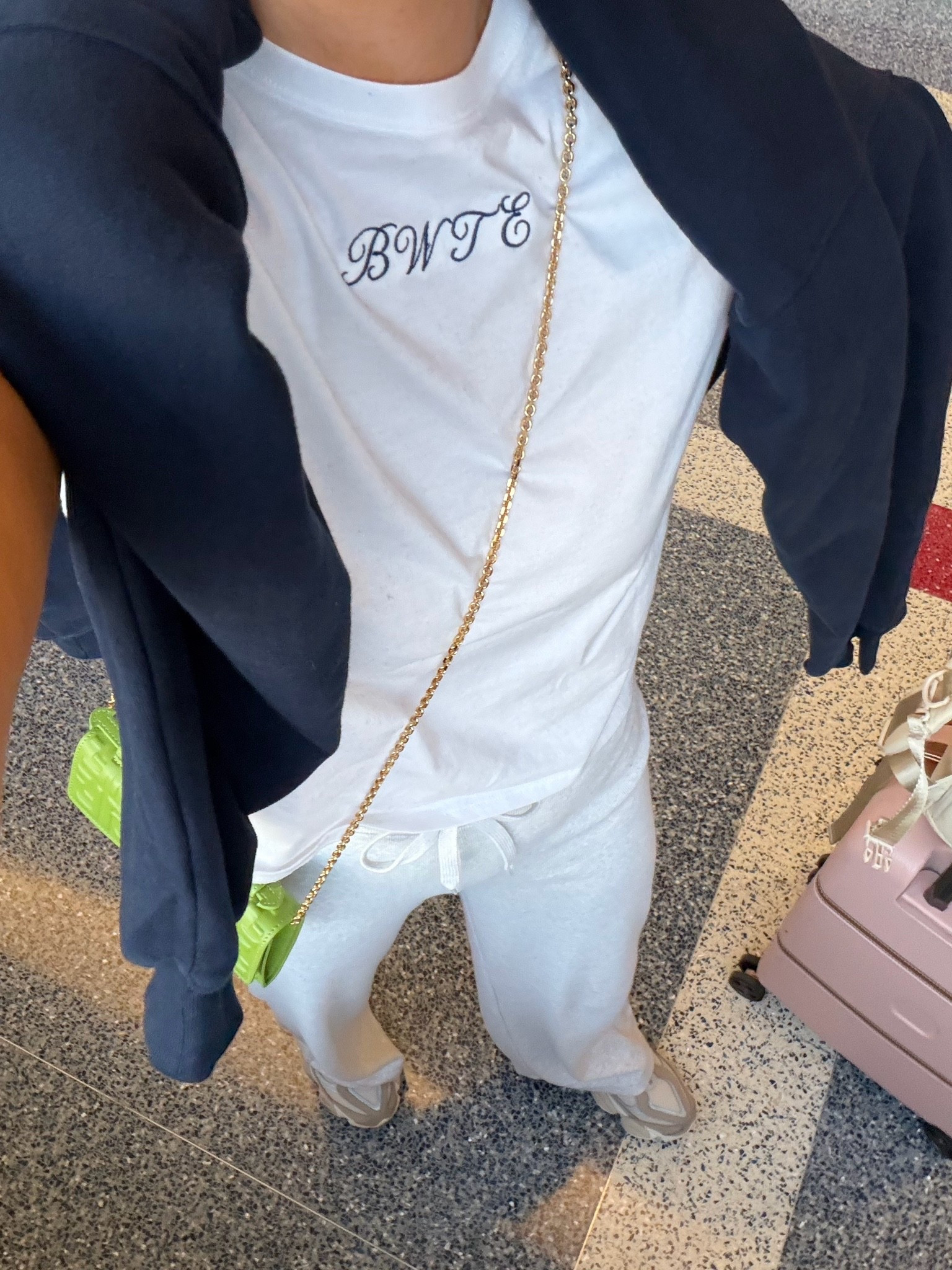 Travel look! Love this perfect white tee- sized up to a medium and now I want every t shirt monogrammed! Wearing medium in sweatshirt and small in pants too!

#LTKPetite #LTKTravel #LTKootd