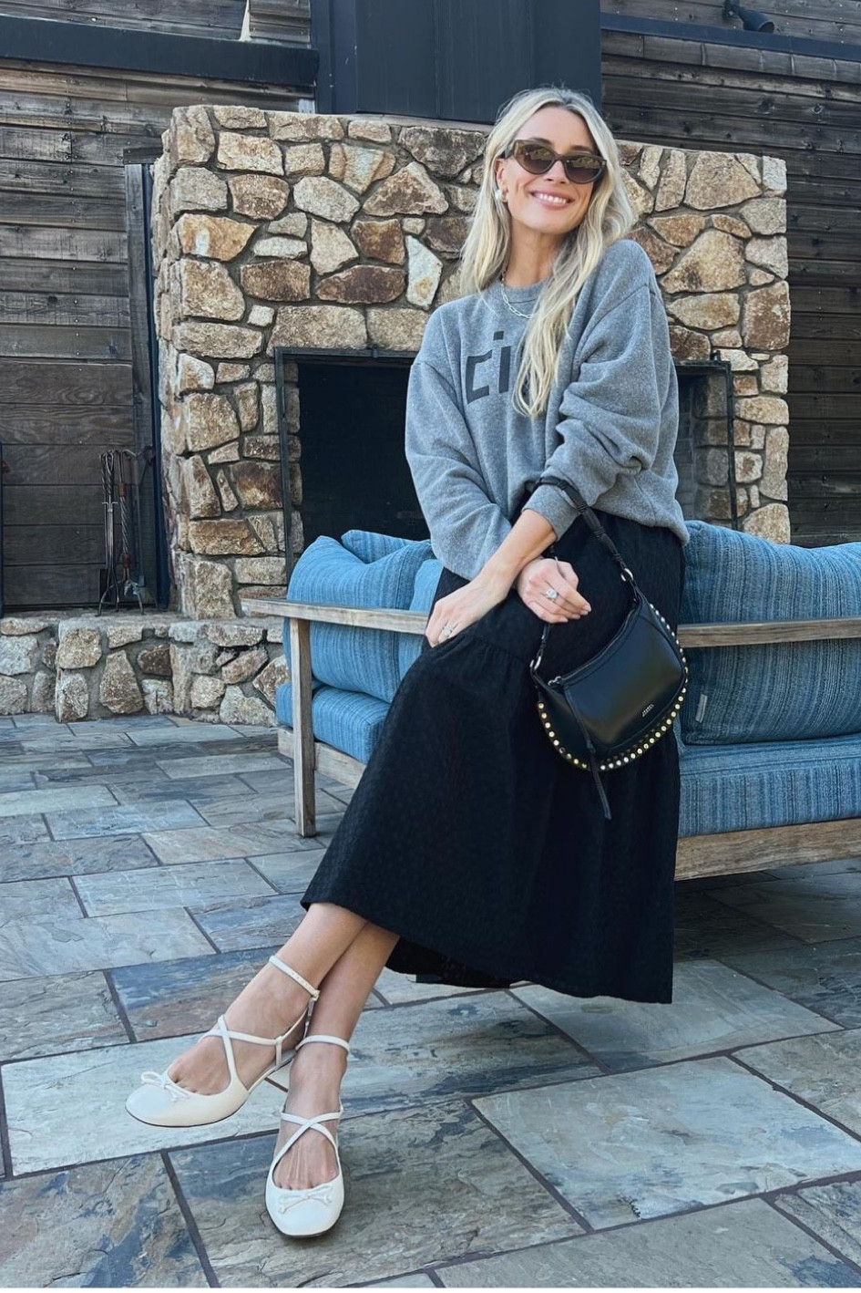 Shop Ariel Vandenberg's black rattan eyelet skirt, graphic sweatshirt and lace up ballet shoes 