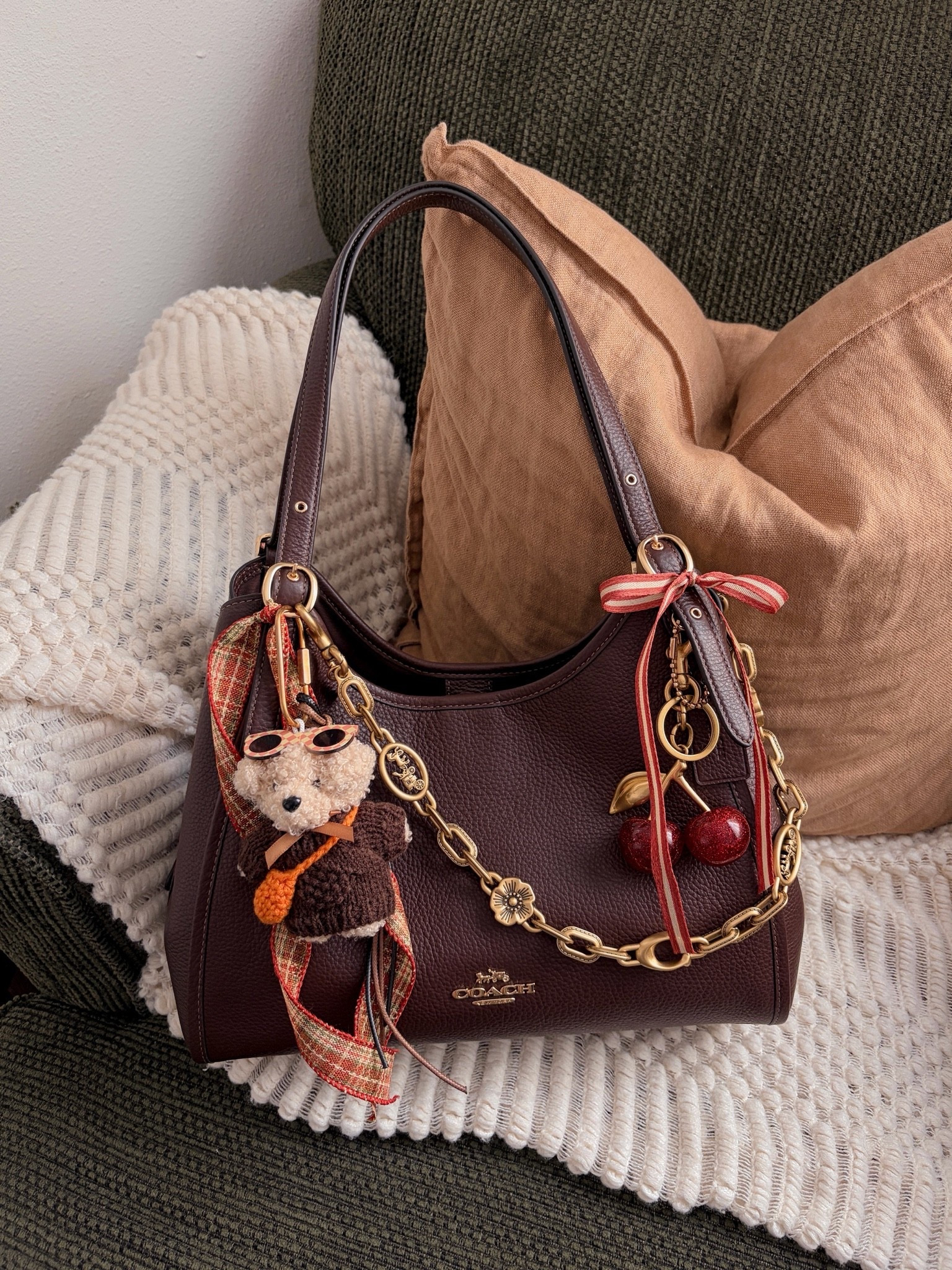 ready for october! 🍁 Coach bag, Coach handbag, Coach purse, Coach shoulder bag, Coach hobo bag, brown Coach bag, dark brown handbag, brown shoulder bag, Coach bag accessories, handbag accessories, bag charm, purse charms, handbag charms, Coach bag charm, cherry bag charm, cherry accessories, fall handbag, fall purse, fall accessories, autumn accessories, fall fashion, autumn fashion, brown accessories, burgundy accessories, plaid accessories, tartan accessories, ribbon bag charm, bow bag charm, personalized handbag, decorated handbag, bag styling, handbag styling, purse styling, handbag collection, Coach collection, designer handbag, affordable luxury handbag, everyday handbag, classic handbag, timeless handbag, trendy handbag, cute handbag, statement accessories, fall outfit accessories, cozy fall aesthetic, preppy fall style, feminine accessories, vintage inspired accessories, handbag inspiration, fall fashion accessories
 

 #LTKdayinmylife #LTKgrwm #LTKootd