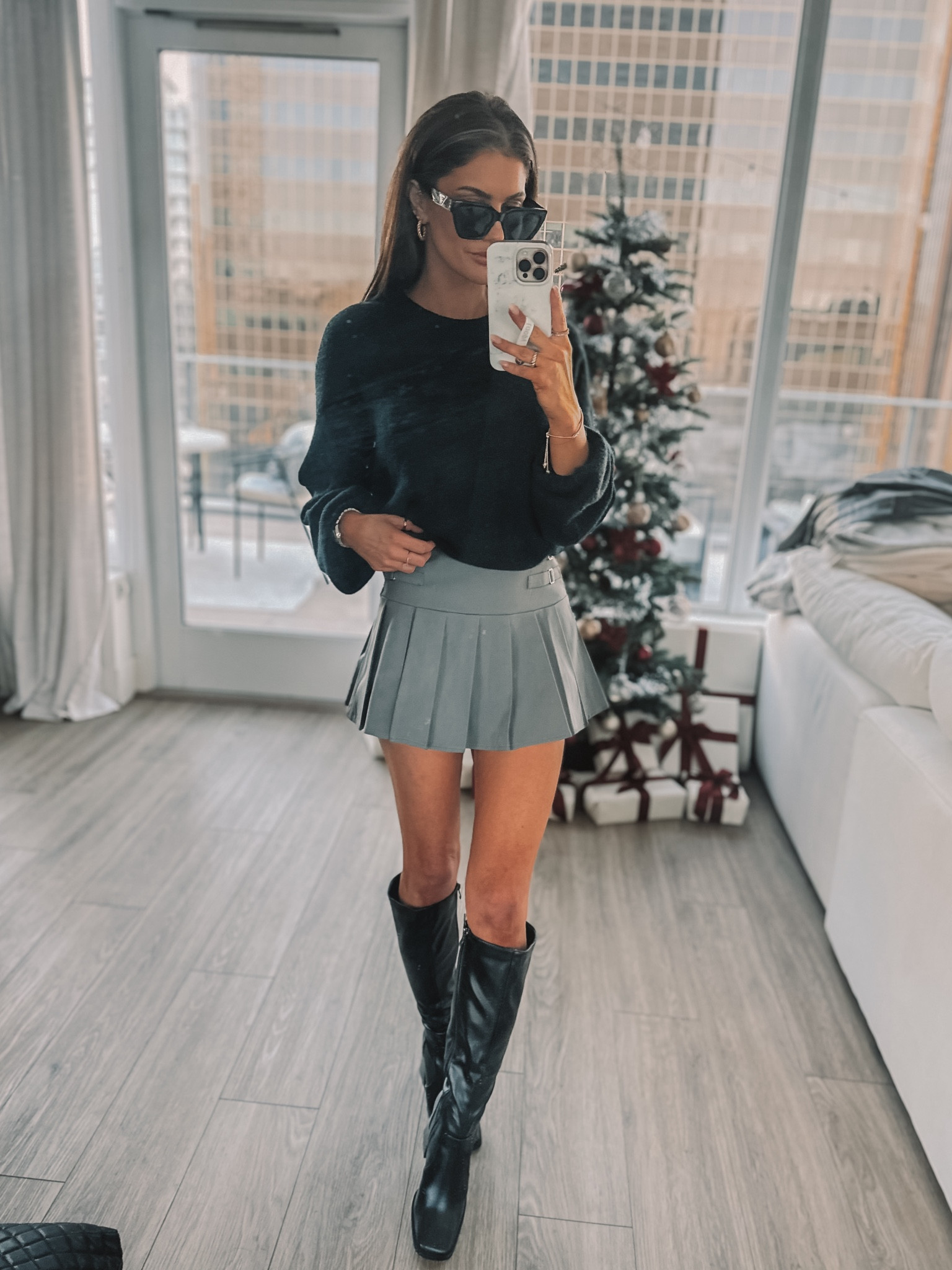 Pleated mini skirt with balloon sweater and knee high black boots 

#LTKGiftGuide #LTKSeasonal #LTKstyletip