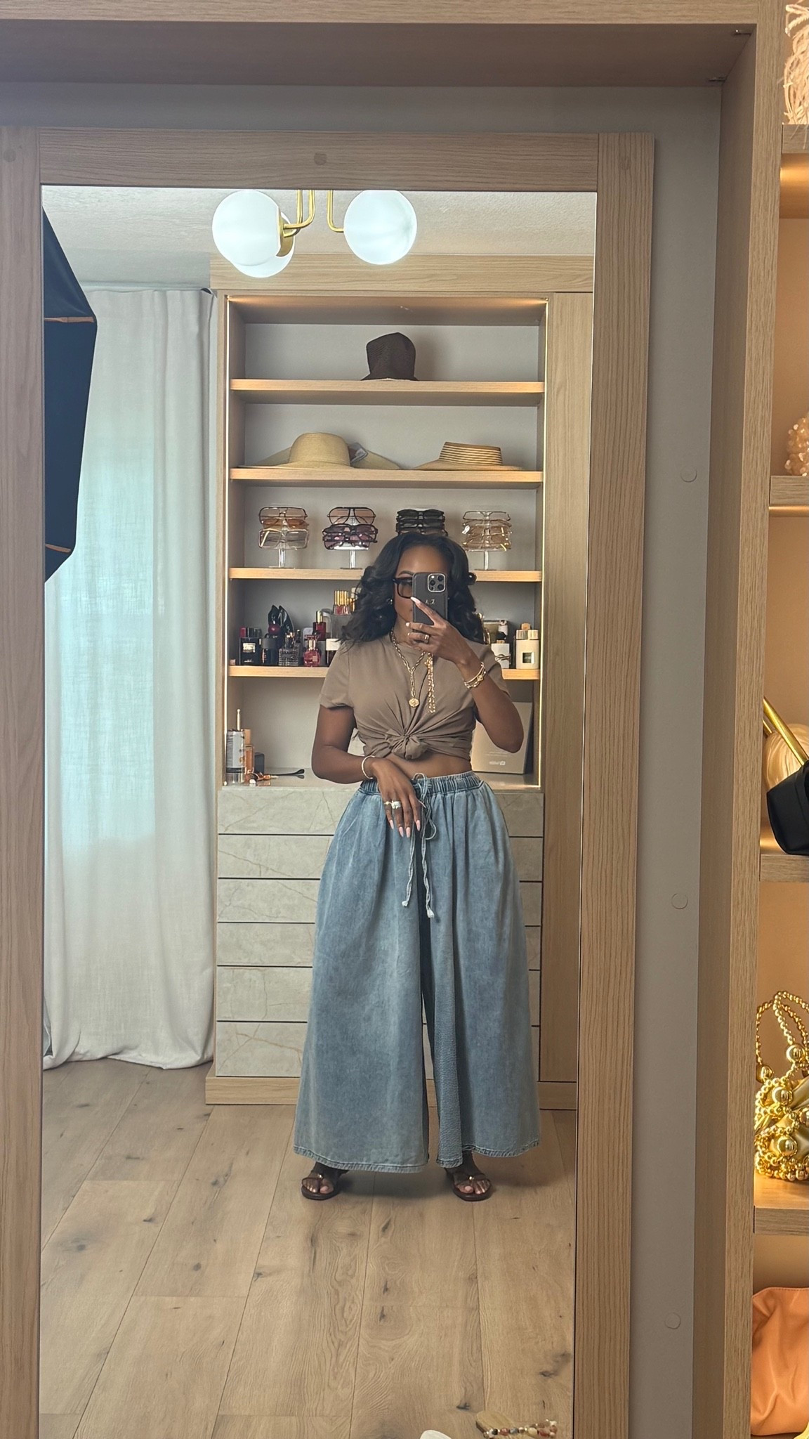 The kind of outfit that feels effortless but still looks elevated every single time 🤎✨

These flowy wide-leg denim pants are such a statement piece while still being easy to wear, and paired with the neutral fitted tee + brown accessories gives that rich casual look everyone’s loving right now. A perfect example of a comfortable outfit that still feels styled.

Perfect for brunch, coffee runs, casual date nights, vacation outfits, shopping days, travel looks, and everyday chic styling.

5’4 | 140LBS | 34D-27-40 | size small or 4

Wide leg denim pants, casual chic outfit, elevated everyday style, dark neutral outfit, effortless summer fashion, comfy wide leg jeans, rich girl casual outfits, relaxed denim look, capsule wardrobe outfit, minimalist fashion inspo, casual vacation outfit, neutral aesthetic outfit

Follow me on Instagram and YouTube @kirasfashionfinds