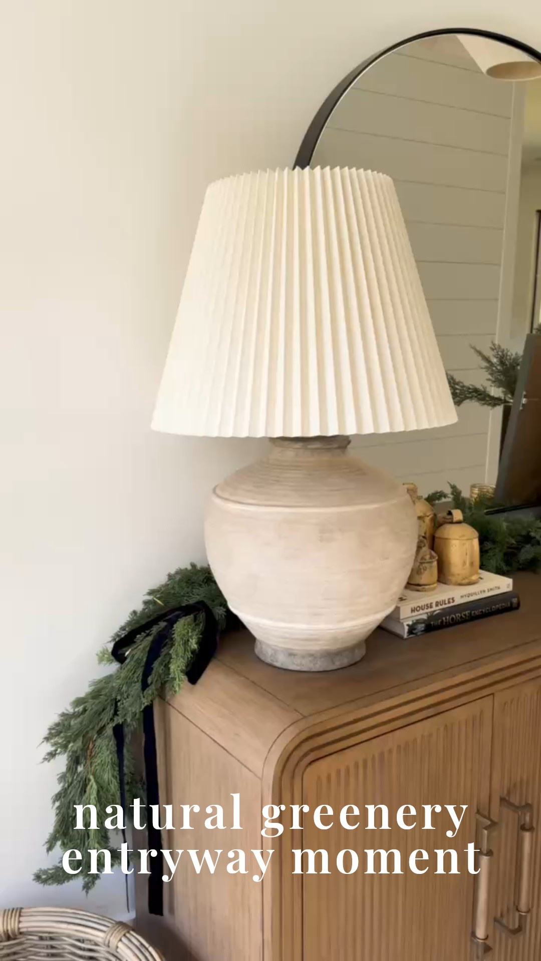 ✨ Want your entryway to feel festive and elevated the second guests walk in?
This Modern Classic setup layers an arched black mirror, ribbed wood console, textured ceramic table lamp, fresh greenery garland, brass bells, neutral art, and a moody charcoal vase for the perfect seasonal welcome. Warm, minimal, and beautifully curated.

#porcheandco #holidayentrywaydecor #modernclassicentryway #archedmirrordecor #greenerygarland #christmasconsoledecor #neutralholidayhome #ceramicdecorstyle #brassbellsholiday #cozyseasonaldecor #entrywaystylingideas

Do you want to bring our dreamy Modern Classic style interior design into your own home? 🏡 You’re in luck! Reserve our Online Interior Design packages today -> https://porcheandco.com/edesign ✨ We can’t wait to work with you & design your home with #porcheandco


#LTKHoliday #LTKSeasonal #LTKHome