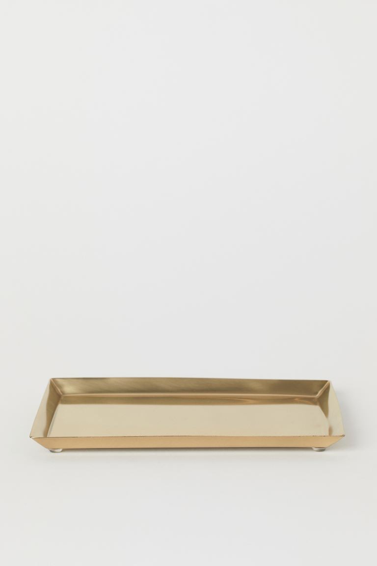 Small metal tray with a small, angled rim. Feet at base. Size 6 1/4 x 8 3/4 in. | H&M (US + CA)