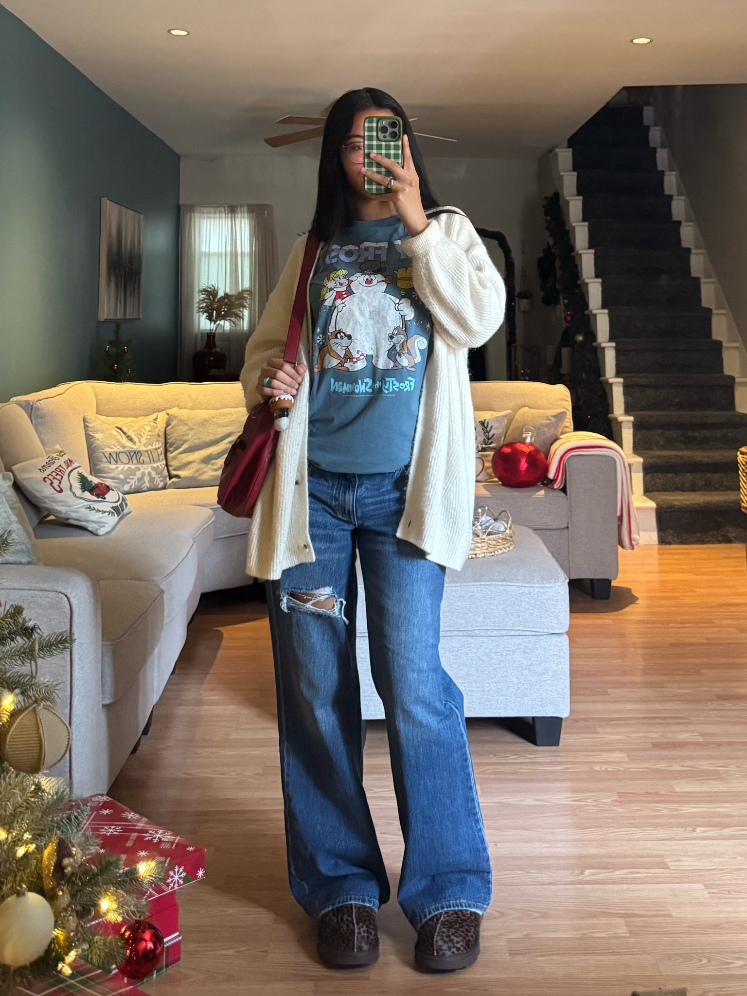 Frosty tshirt, winter tshirt, blue shirt, white cardigan, cozy cardigan, cream cardigan, cheetah Ugg slippers, ugg slippers, Uggs, denim jeans, wide bottom jeans, red bag, shoulder bag 

#LTKSwim #LTKStyleTip #LTKSeasonal