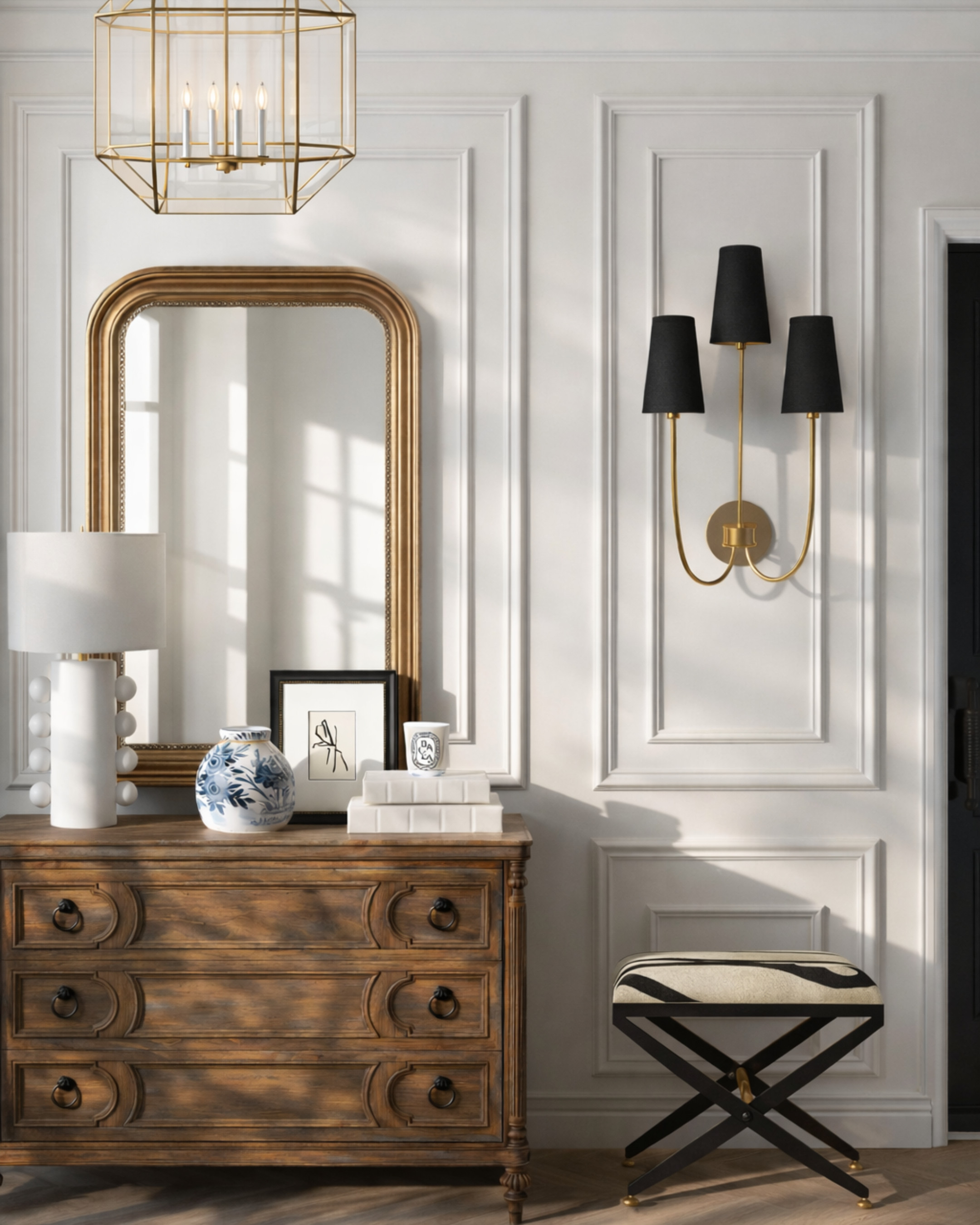 Classic entryway, but make it feel layered and intentional 🤍
This is one of those setups that instantly elevates your home the second you walk in—warm wood tones, crisp paneling, and just enough contrast with the black accents to keep it from feeling flat. The mix of traditional (that mirror + dresser) with modern touches (sculptural lamp, graphic bench) is what makes it feel expensive, not overly styled.
If your entryway feels “off,” it’s usually missing scale + contrast + height—this combo nails all three.
Save this for when you’re styling your own entry or looking for pieces that feel timeless but still current. 

 #LTKHome