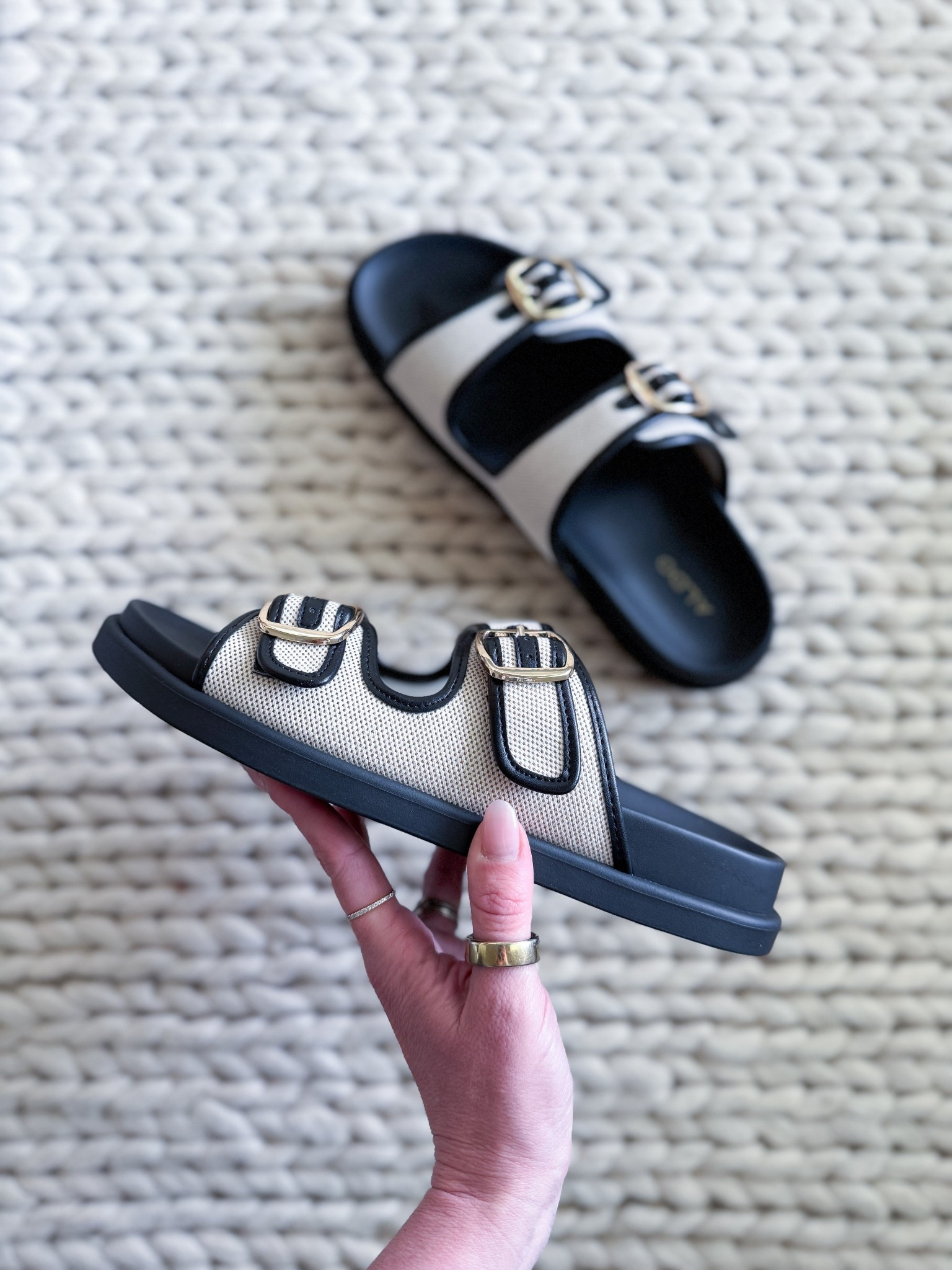These ALDO black & cream buckle slides are my new summer go-to! Comfy, chic & easy to style with everything from denim shorts to sundresses. The double buckle detail adds the perfect touch of polish, making them ideal for casual days or vacation looks. Linked them on LTK so you can grab a pair for your summer wardrobe!

ALDO buckle slides - black & cream sandals - double buckle sandals - trendy summer sandals - comfy summer slides - casual chic sandals - everyday summer shoes - slip on sandals - flat summer sandals - versatile summer footwear - vacation ready sandals - summer shoe trend - stylish summer slides - women’s buckle sandals - LTK summer shoe picks

#LTKSummerEdit #LTKStyleTip #LTKShoeCrush