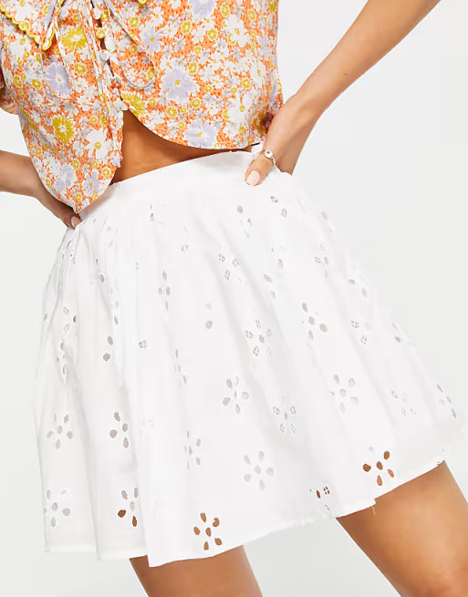 ASOS DESIGN Petite mini pleated tennis skirt in broderie in white | ASOS (Global)