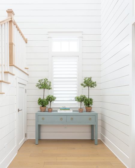 Our entryway decorated for spring with two sizes of faux boxwood topiaries, a white scalloped tray, coastal coffee table books and our blue linen console table! See our full spring tour here: https://lifeonvirginiastreet.com/2024-spring-home-tour/.
.
#ltkhome #ltkseasonal #ltksalelaert #ltkfindsunder50 #ltkfindsunder100 #ltkstyletip

#LTKSeasonal #LTKsalealert #LTKhome