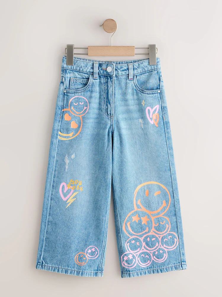 Mid Blue SmileyWorld® Print Wide Leg Jeans (3-16yrs) | Next US