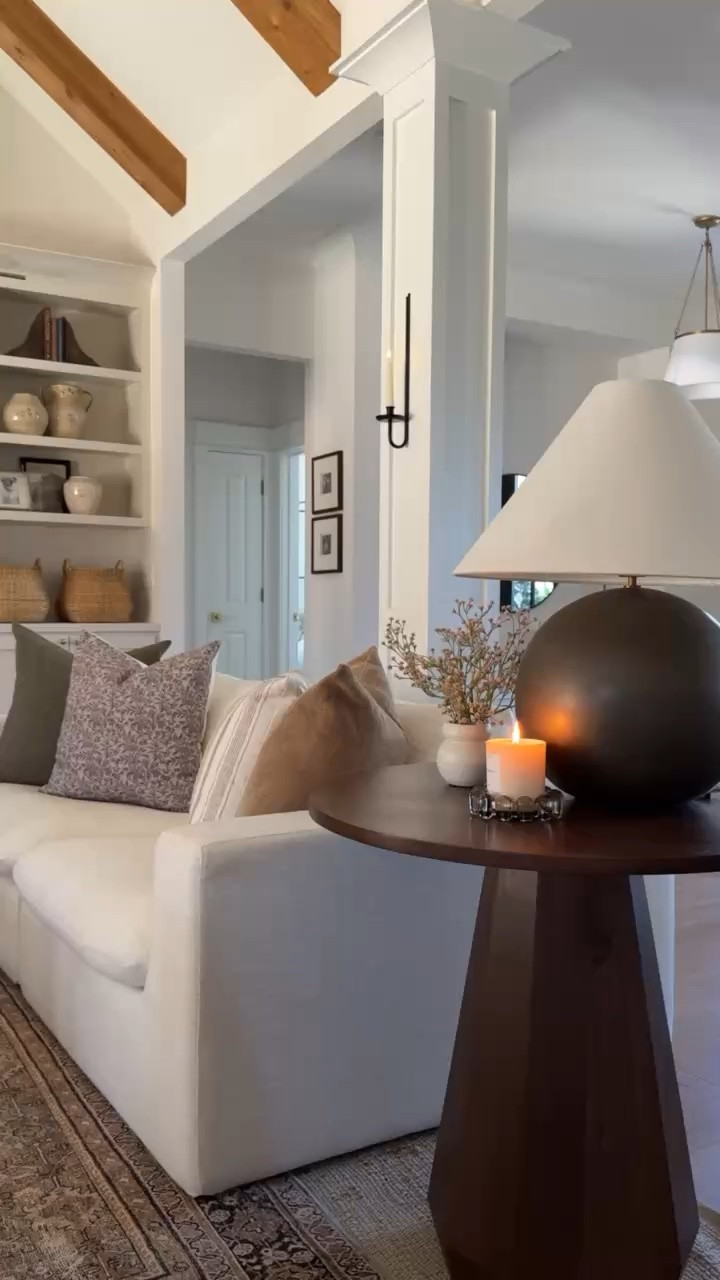 I’m always so enchanted with this POV of our great room. 🤎 The bold, dark table lamp and side table make the space feel so grounded. Plus, I love this view of our styled built-in shelves!

#LTKHome